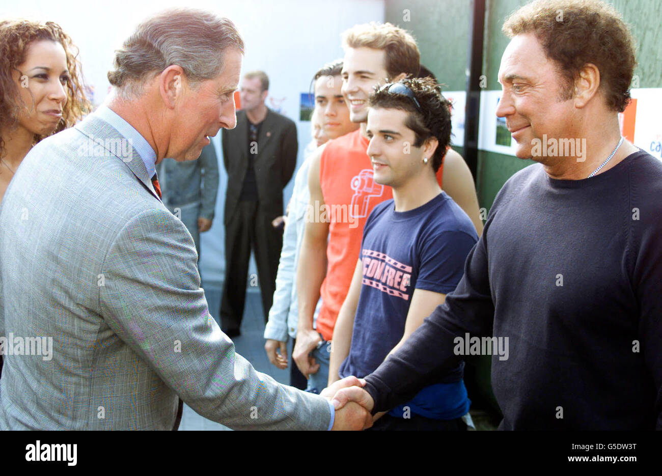 The Prince of Wales greets Welsh singer Tom Jones who performed at the Party in Park, held in Hyde Park central London. Stock Photo