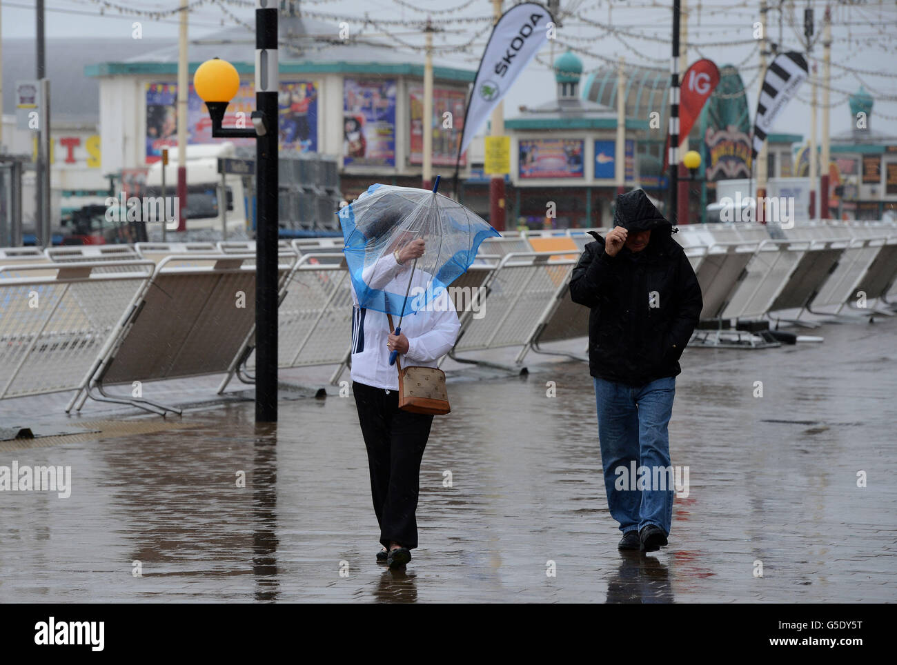 Visitors to Blackpool struggle through torrential rain and strong winds ...