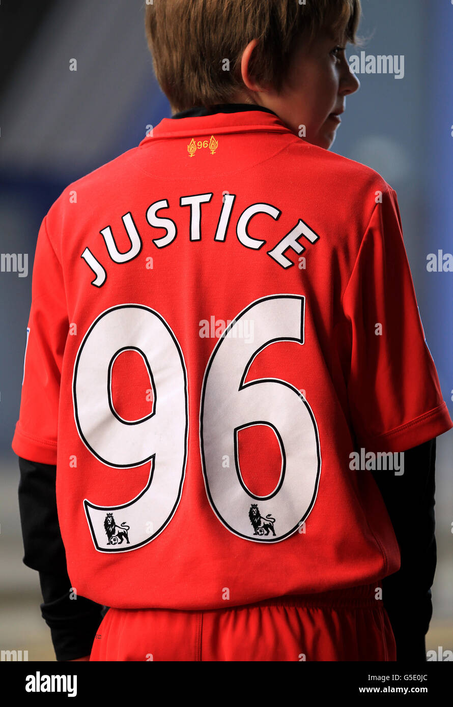 A young Liverpool fan with Justice 96 on the back of his shirt Stock Photo  - Alamy