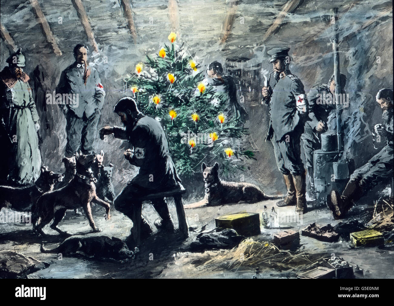 Weihnachten bei den Sanitätern. Christmas with the corpsmen. Germany, war, World War, WWI, 1, history, historical, 1910s, 20th century, archive, Carl Simon,  hand coloured glass slide, German, soldiers, Christmas, tree, dogs, sitting, smoking, candles, reminiscing Stock Photo