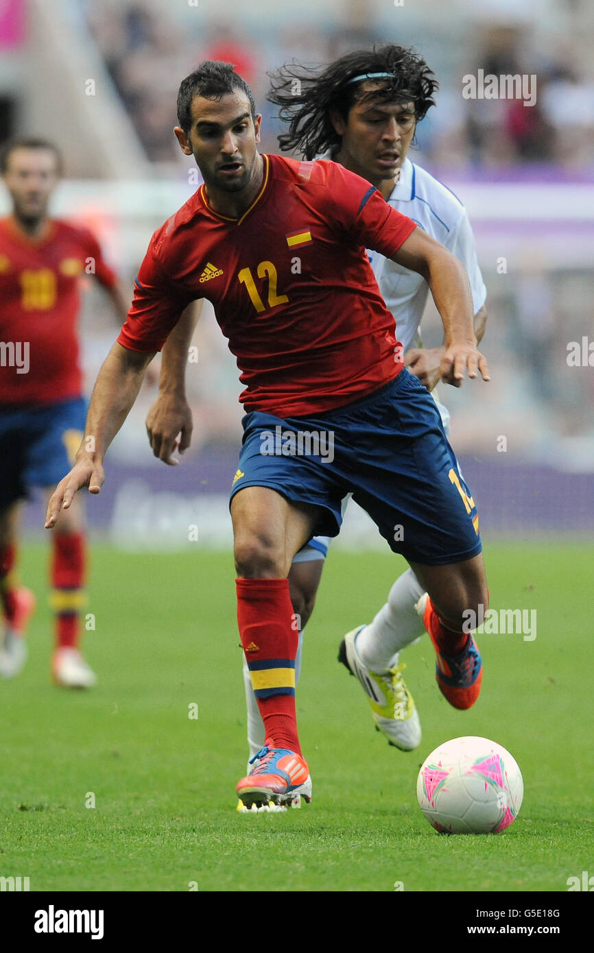 Spain's Martin Montoya and Roger Espinoza of Honduras fight for possession of the ball Stock Photo