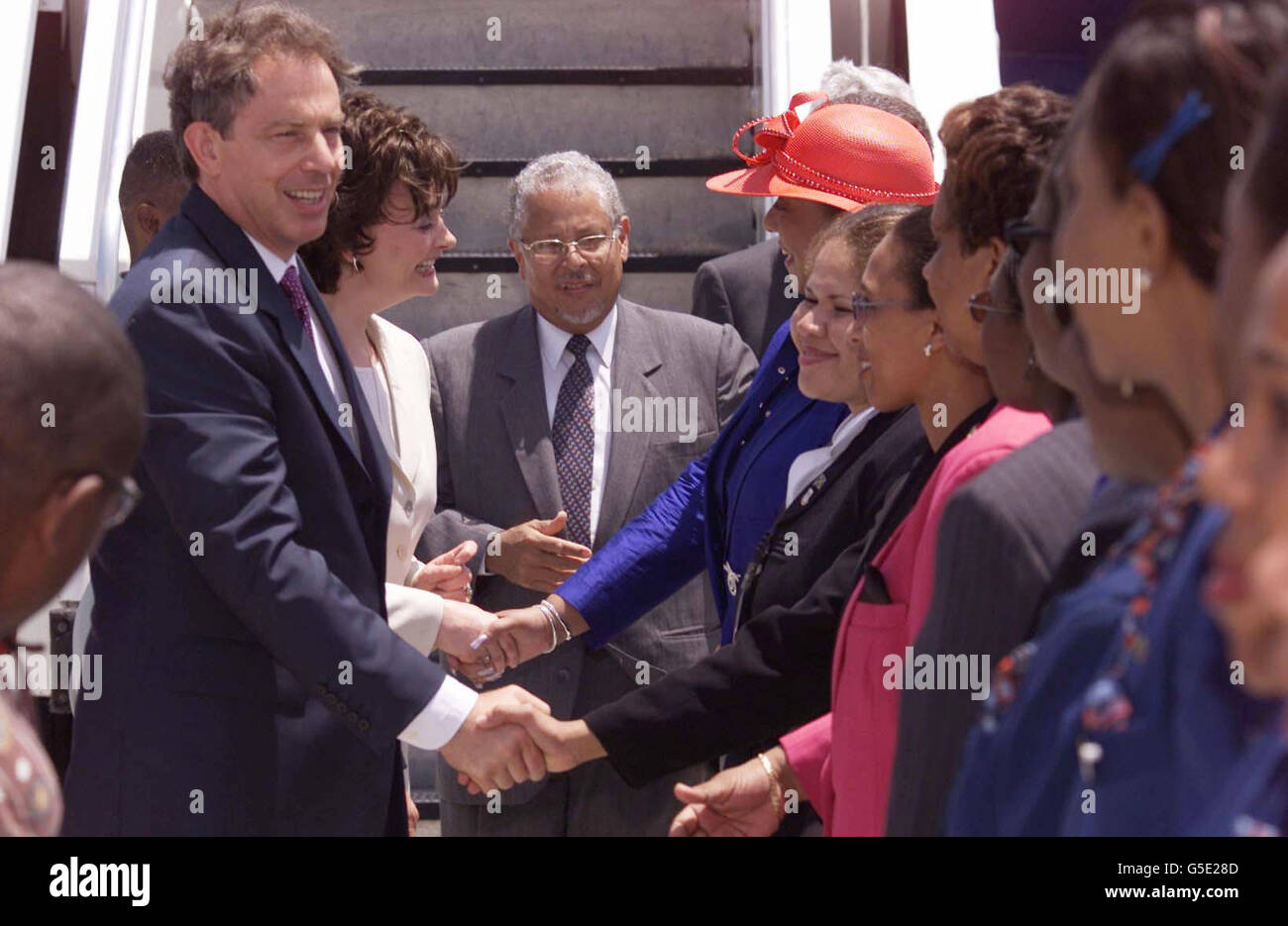 British Prime Minister Tony Blair (left, blue suit) and his wife Cherie