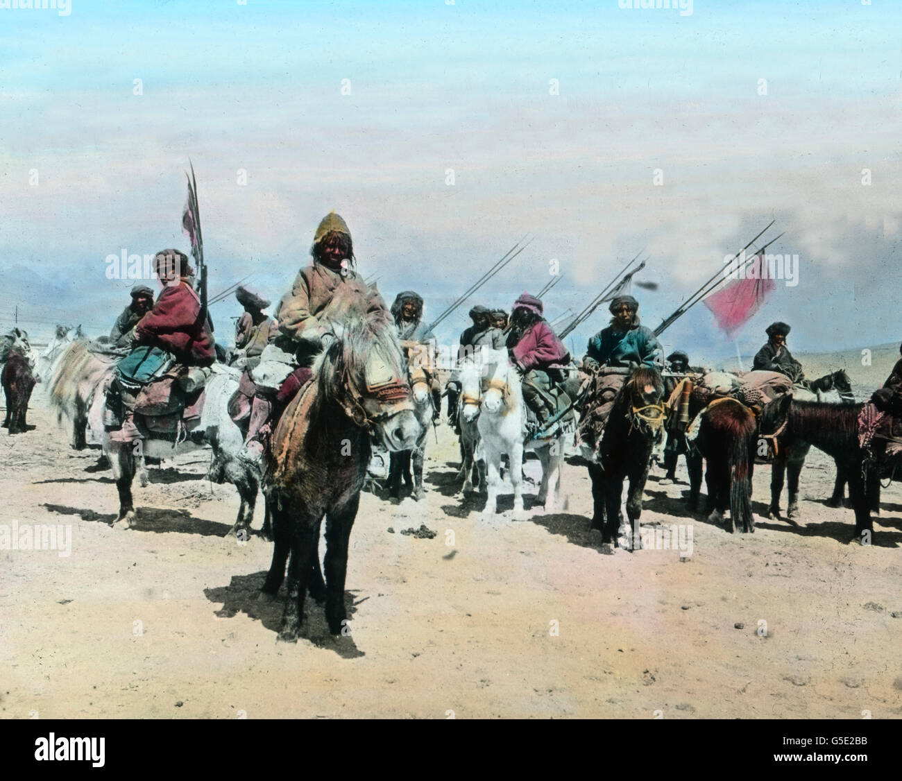 Widerstand in Gartok. Some kind of revolution at Gartok in Tibet. travel, history, historical, 1910s, 20th century, archive, Carl Simon, hand coloured glass slide, rider, men, fighters, mule, rebels Stock Photo