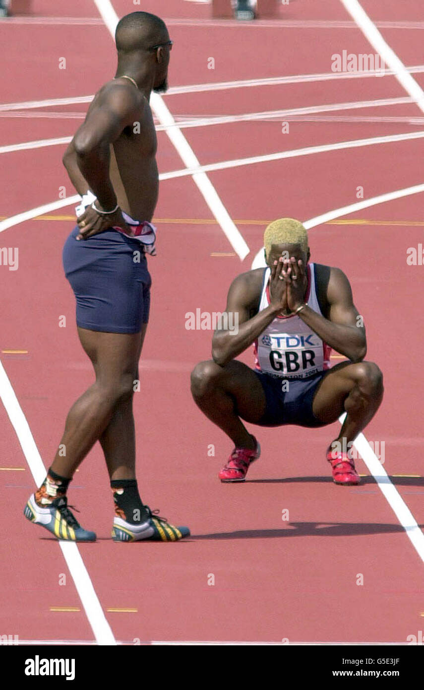 A distraught Christian Malcolm (right) after he failed to make the change in the 4 x 100m (men) relay at the IAAF World Championships in Edmonton, Canada. Stock Photo