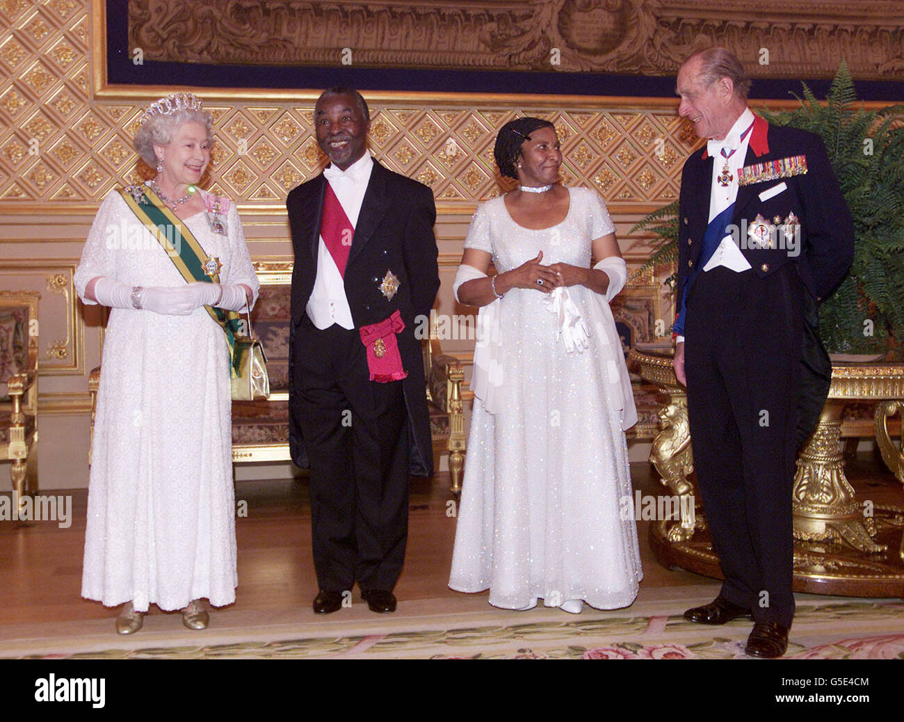 Britain's Queen Elizabeth II, South African President Thabo Mbeki (2L) his wife Zanele (2R) and the Duke of Edinburgh talk as they attend the state banquet in St George's Hall at Windsor Castle, Berkshire, during his state visit to Britain. * The President and his wife are on a four day trip which will include visits to London and Scotland where he will address the Scottish Parliament. Stock Photo