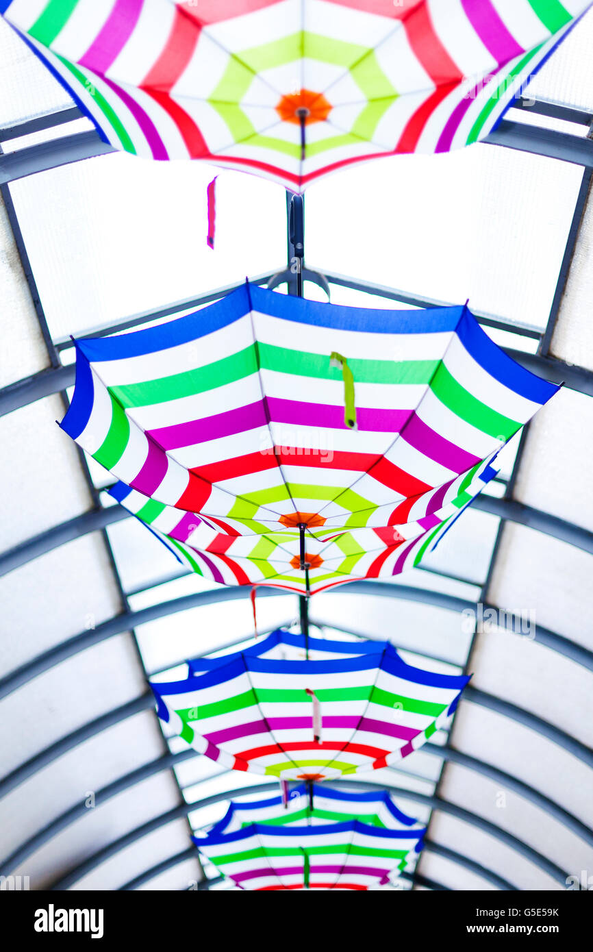 Colorful umbrellas hanging from ceiling hires stock photography and