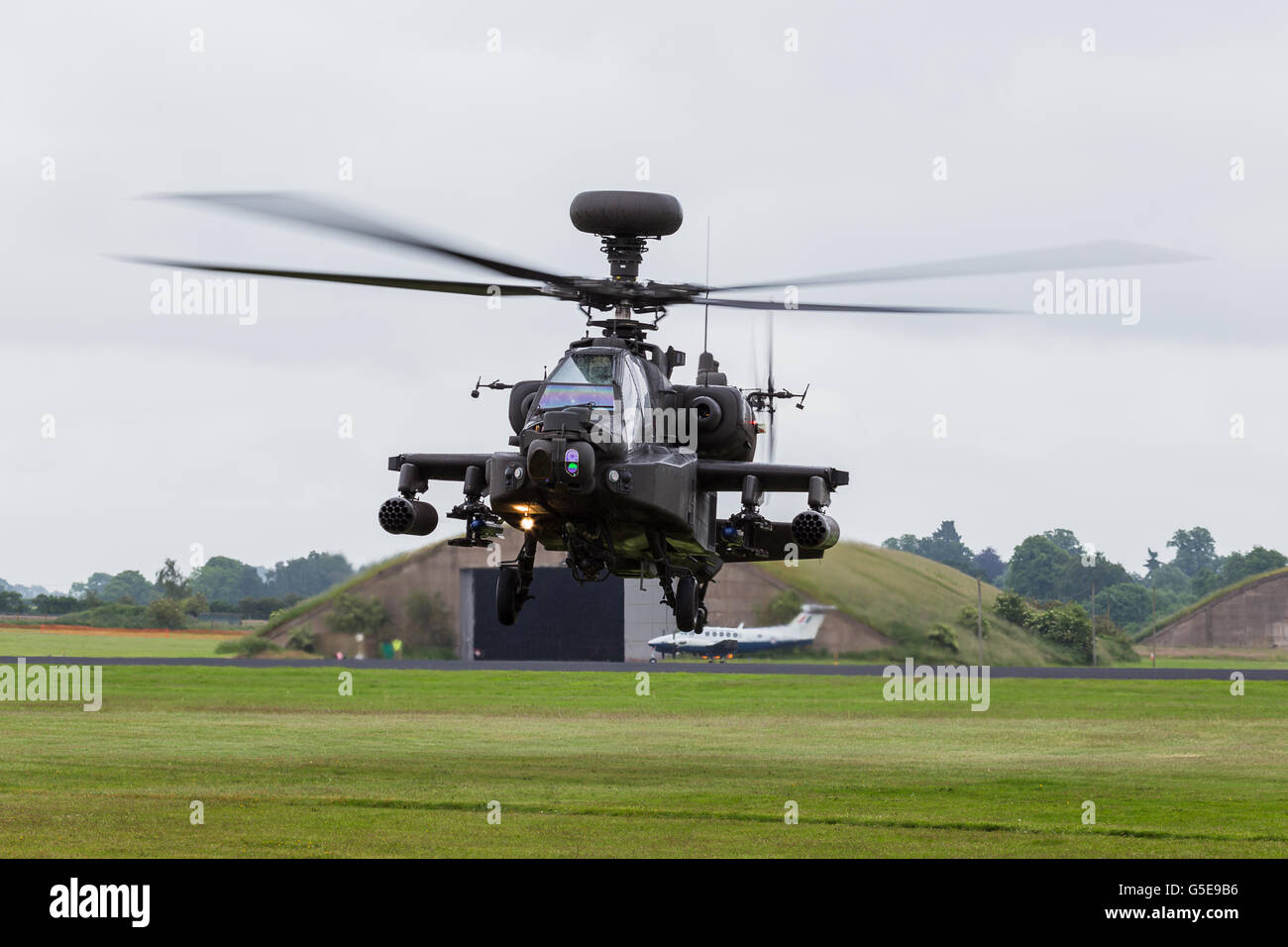 Army Air Corp Apache turns during a hover Stock Photo