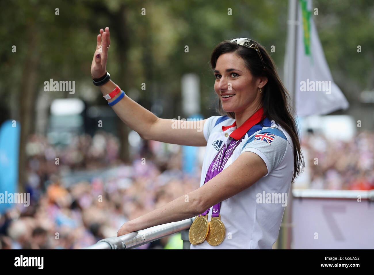 British Paralympic gold medal winning cyclist Sarah Storey waves to the crowd during the London