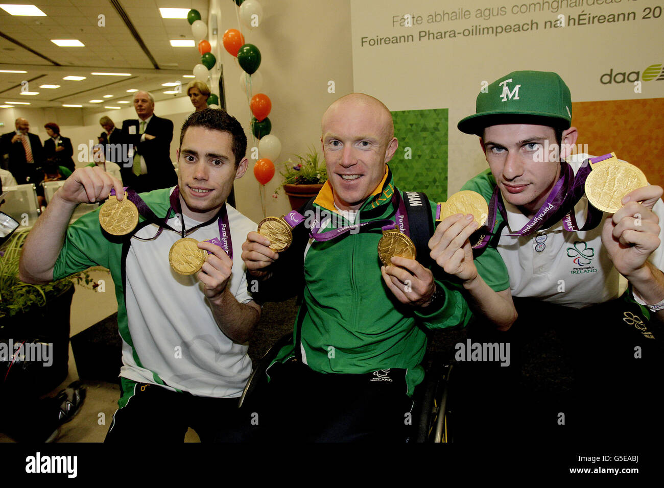 Double Gold medal winners at the London 2012 Paralympic Games Jason Smyth, Mark Rohan and Michael McKillop (L-R) arrive back into Dublin Airport to a massive welcome after the team's fantastic medal haul at the games. Stock Photo