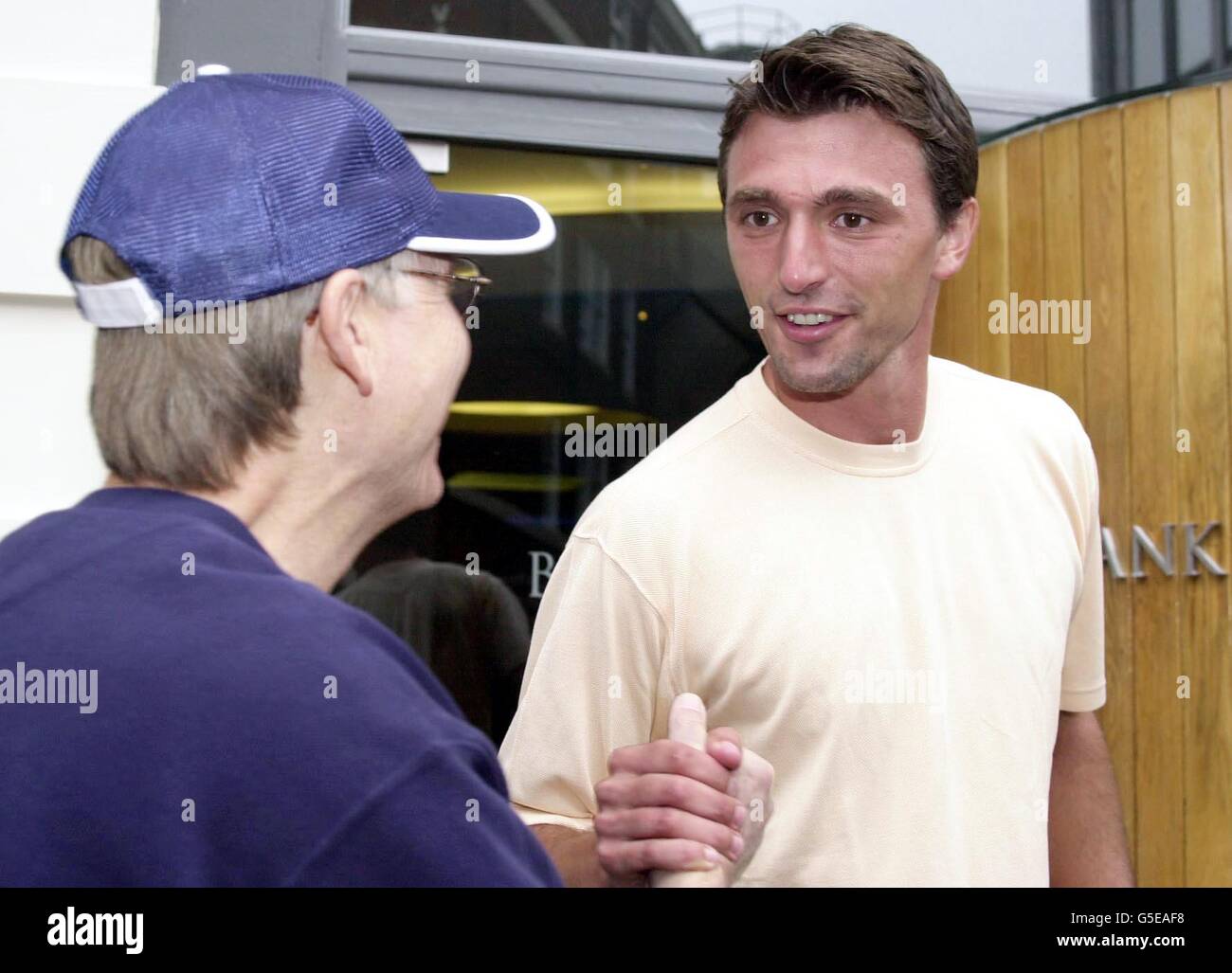 Wild card Wimbledon champion Goran Ivanisevic is greeted by a fan as he leaves a press conference in London. The 29-year-old Croat, won a dramatic five-set battle with Australian Pat Rafter in his fourth Wimbledon final. Stock Photo