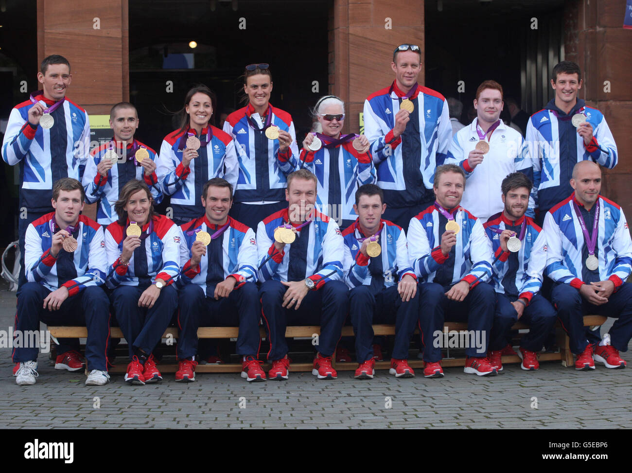 Olympians and Paralympic team members, (back row left to right) David Florence, Neil Fachie, Emily Maguire, Heather Stanning, Aileen McGlynn, David Smith, Daniel Purvis and Michael Jamieson (front row left to right) James Clegg, Katherine Grainger, Tim Baillie, Sir Chris Hoy, Scott Brash, Craig Maclean, Luke Patience and Sam Ingram, pose for a group picture prior to the official victory parade for Scotland's Olympic and Paralympic teams in Glasgow. Stock Photo