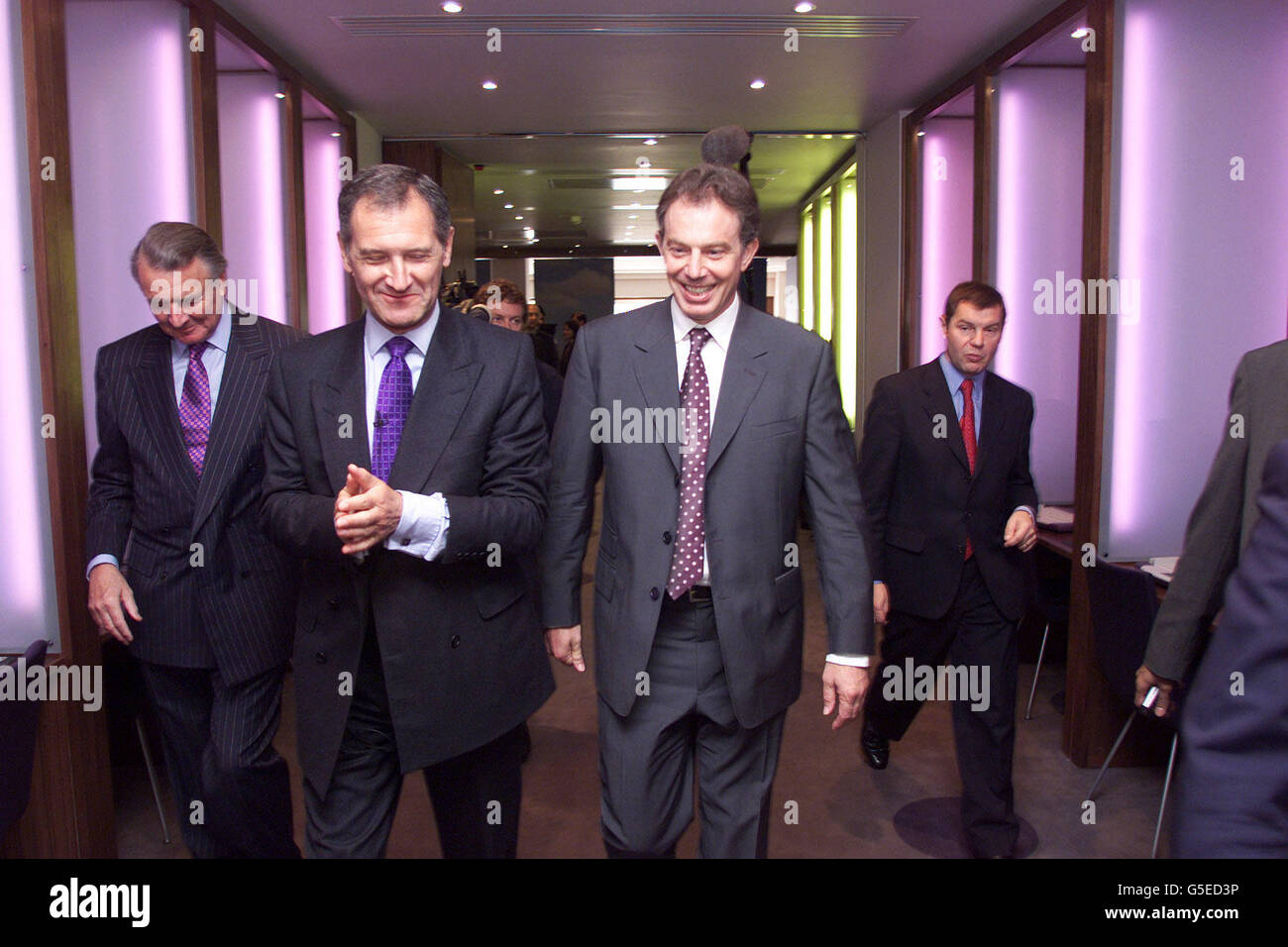 Prime Minister Tony Blair, walks with George Cox, Director General (L) of the IoD centre as Blair opened the Institute of Directors Building (IoD) centre at Pall Mall, central London. Stock Photo