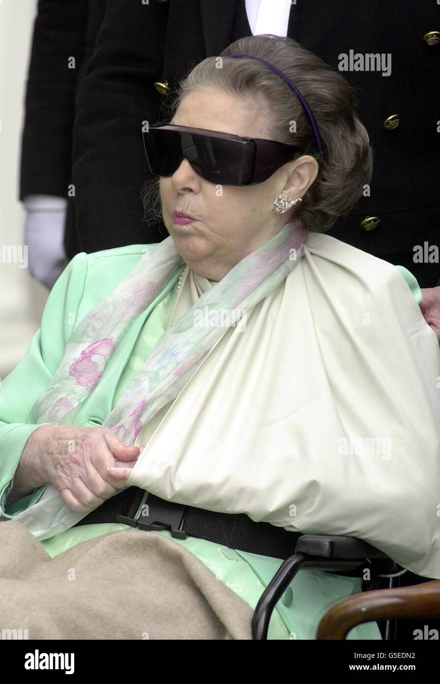 Princess Margaret in a wheelchair and with her arm in a sling, and dark  glasses with the rest of the Royal Family outside Clarence House in London,  as Queen Elizabeth The Queen