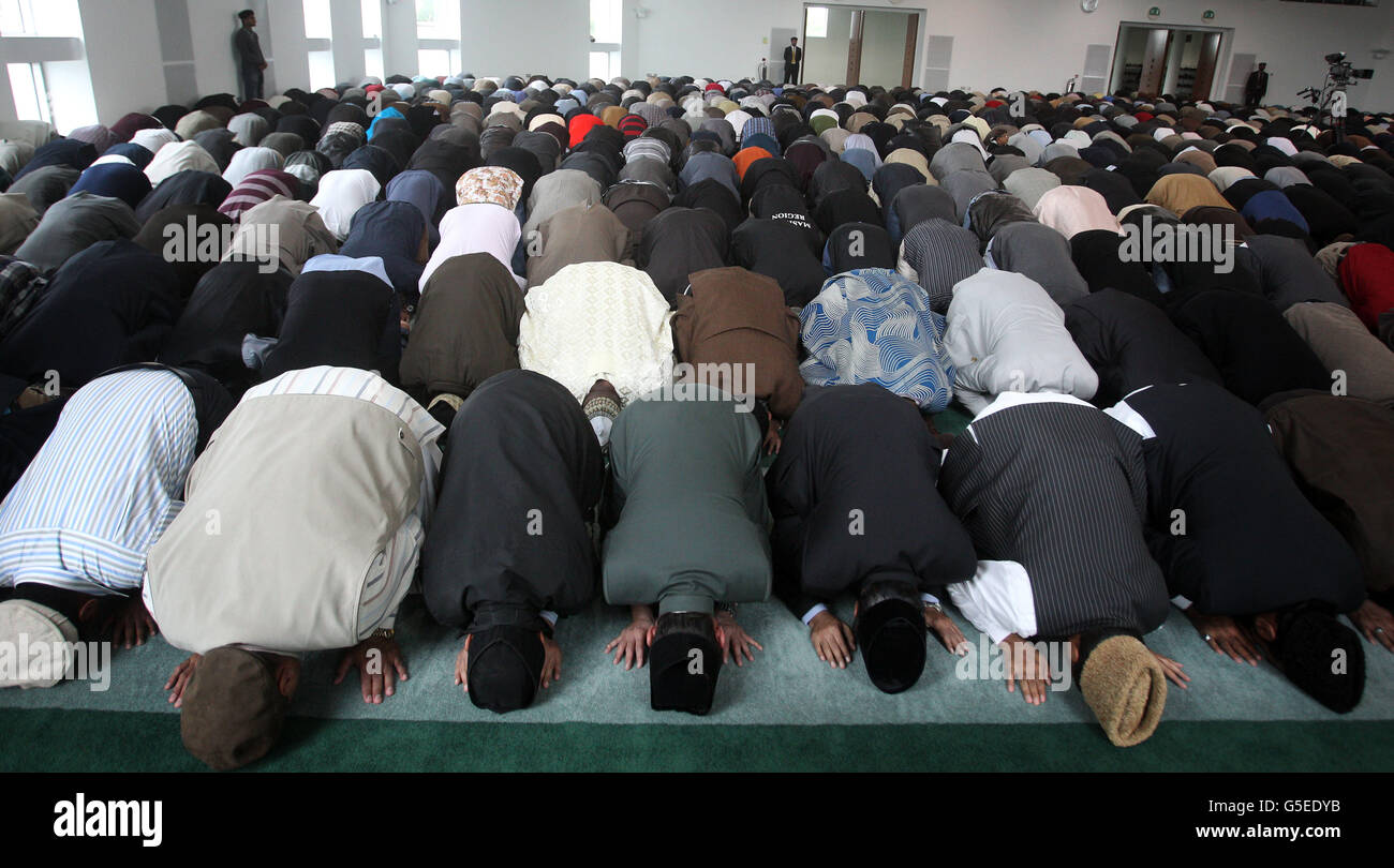 Muslims congregate at the Baitul Futuh Mosque in Morden, to listen to the Islamic Khalifa's sermon and to denounce the anti-Islamic film entitled 'Innocence of Islam'', the community also denounced the violent reaction to the film. Stock Photo