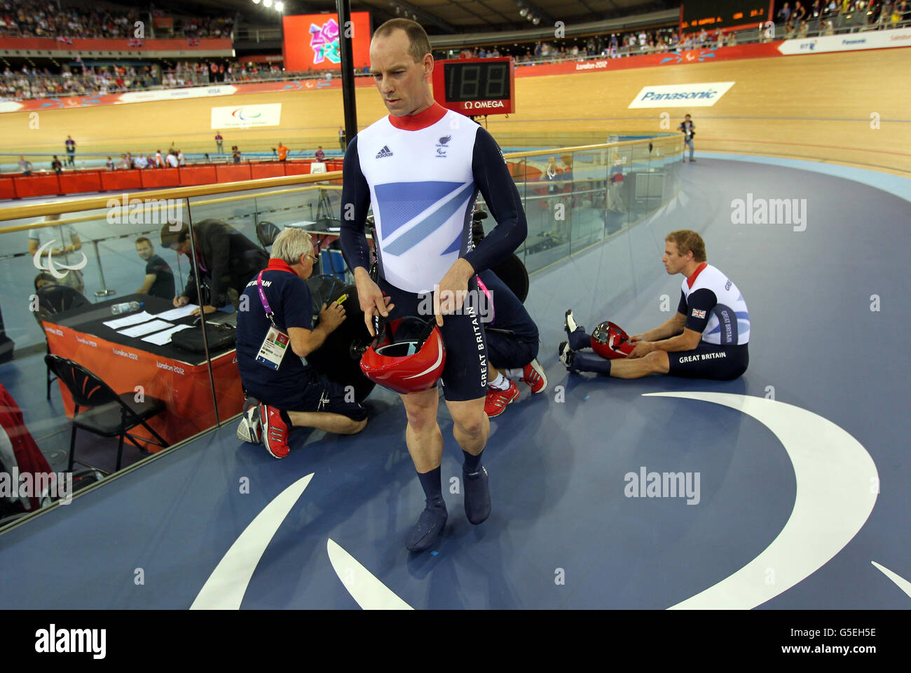Great Britain's Anthony Kappes leaves his bike after a second false start in the Men's Individual B 1km Time Trial at the Velodrome in the Olympic Park, London. Stock Photo