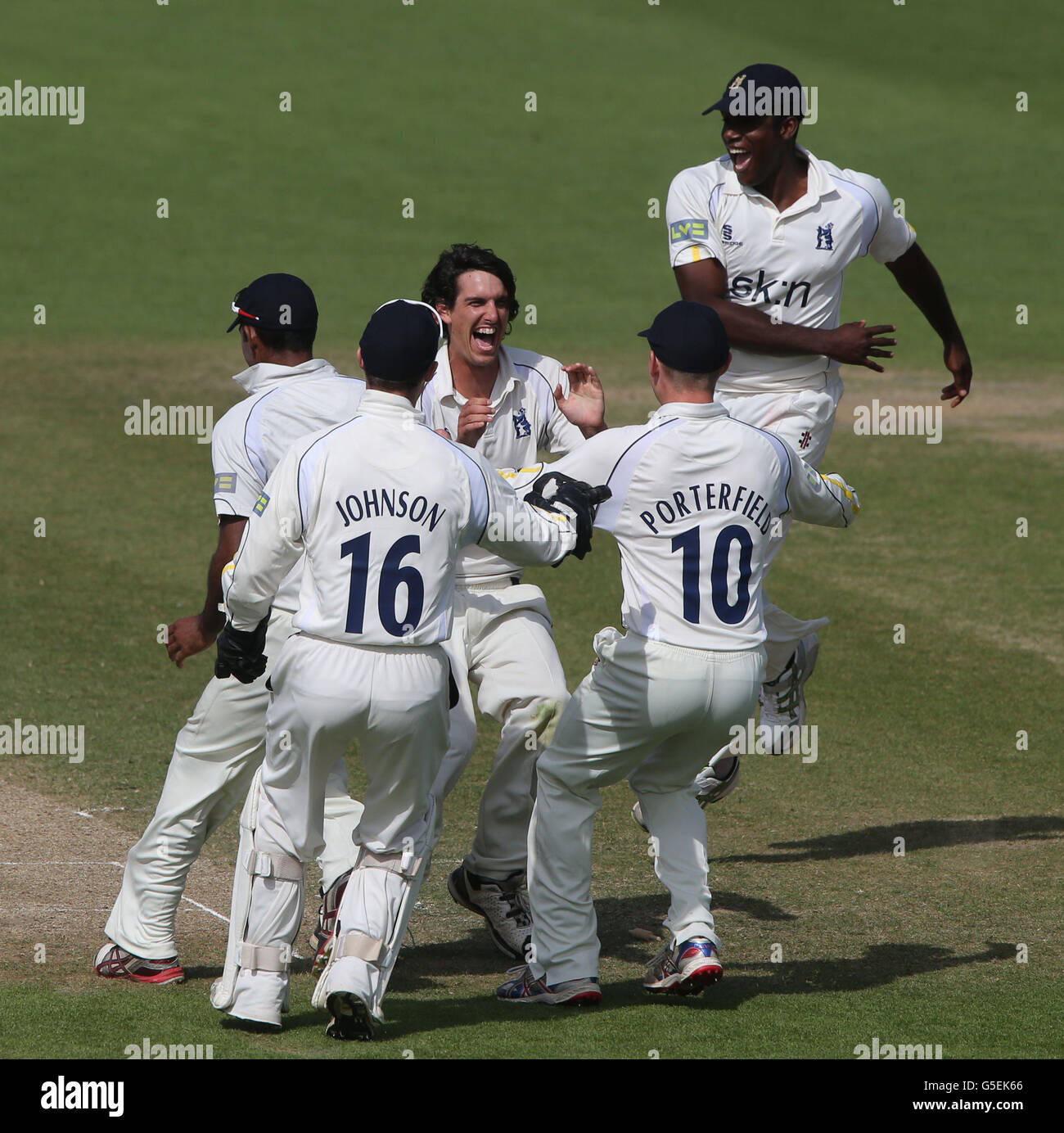 Warwickshire's bowler Chris Wright (2nd right) celebrates taking the wicket of Worcestershire's Alan Richardson to win the LV County Championship during the LV=County Championship Division One match at New Road, Worcester. Stock Photo