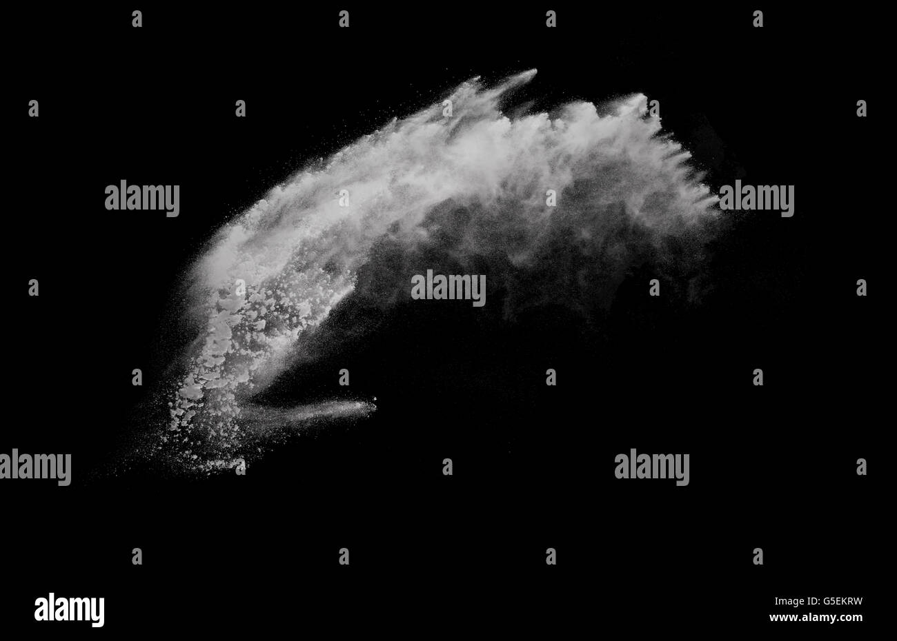 White powder explosion isolated on black background Stock Photo - Alamy