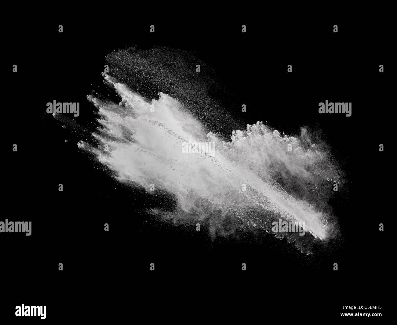 White powder explosion isolated on black background Stock Photo - Alamy