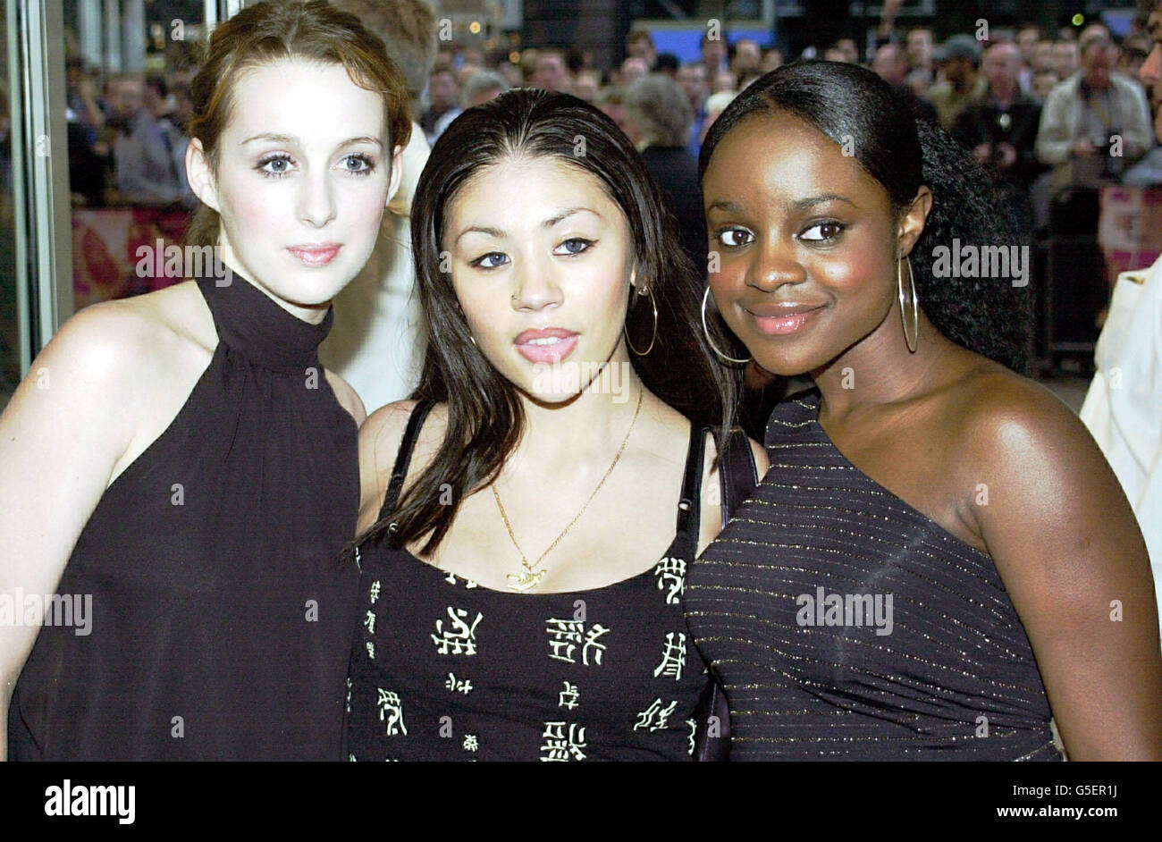 (L-R) Singers Siobhan Donaghy, Mutya Buena and Keisha Buchanan from the girl band Sugababes arrive for the premiere of the film High Heels and Low Lifes in London's West End. Stock Photo