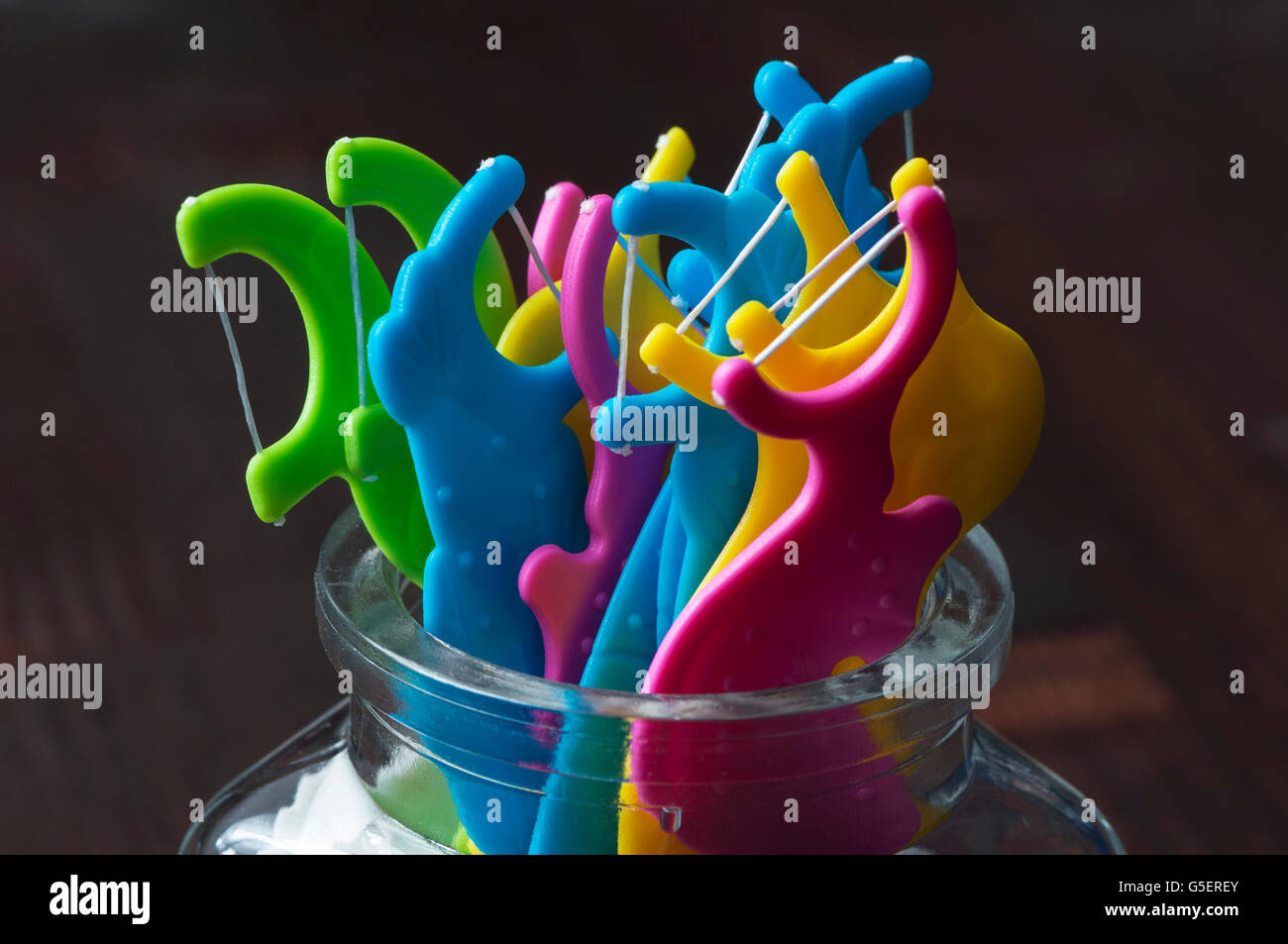 Dental floss sticks on a wooden table Stock Photo Alamy