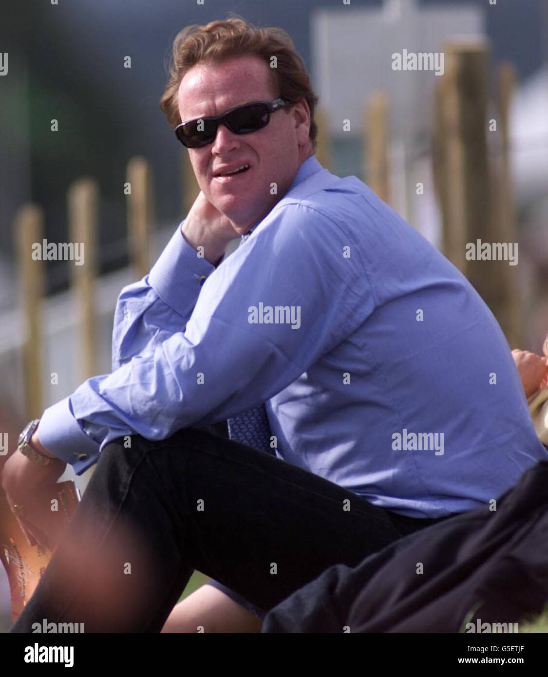 James Hewitt watches the final of the Veuve Clicquot Gold Cup polo competition at Cowdrey Park in Midhurst, West Sussex. Stock Photo