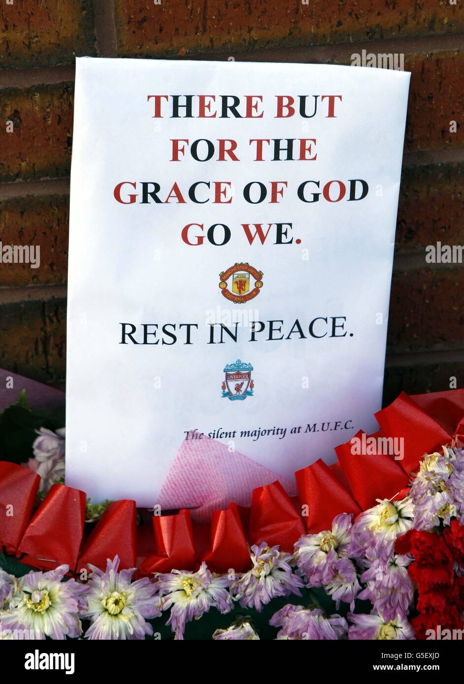 Tributes left at the Hillsborough Memorial outside the football ground at Anfield in Liverpool by Manchester United supporters. Stock Photo