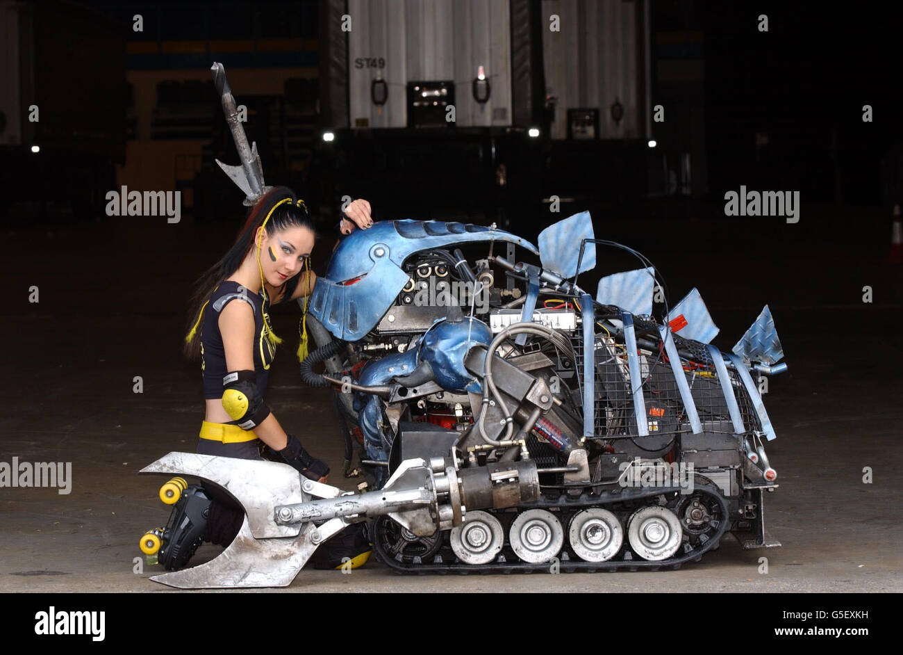 Robobabe Emily Vincent with one of the the house robots promoting The Robot Wars Live Event, taking place at the London Arena and at the Wembley Arena. Stock Photo