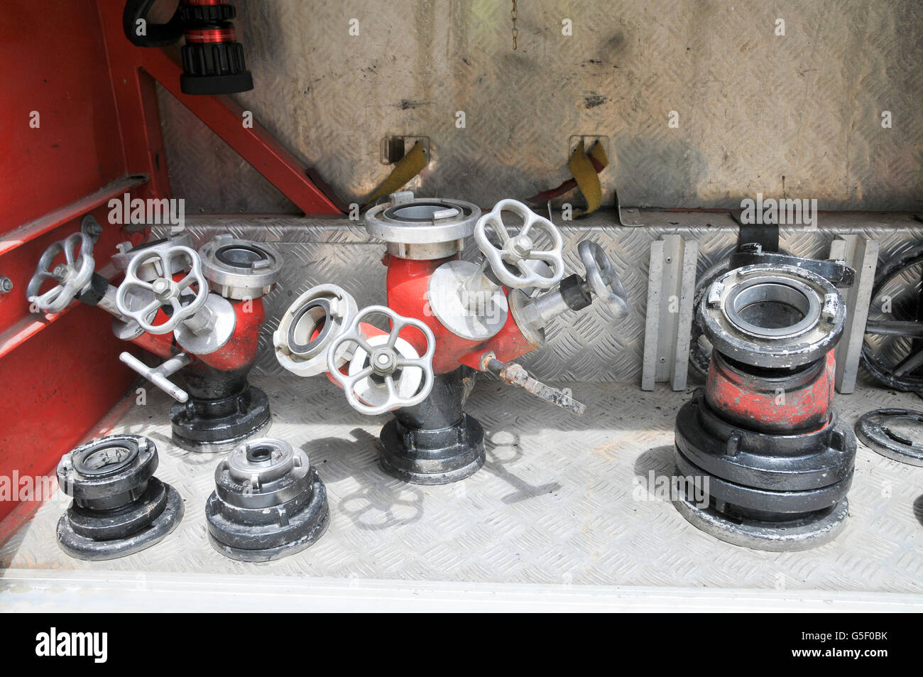 Fire fighters equipment hoses on a rack Stock Photo - Alamy
