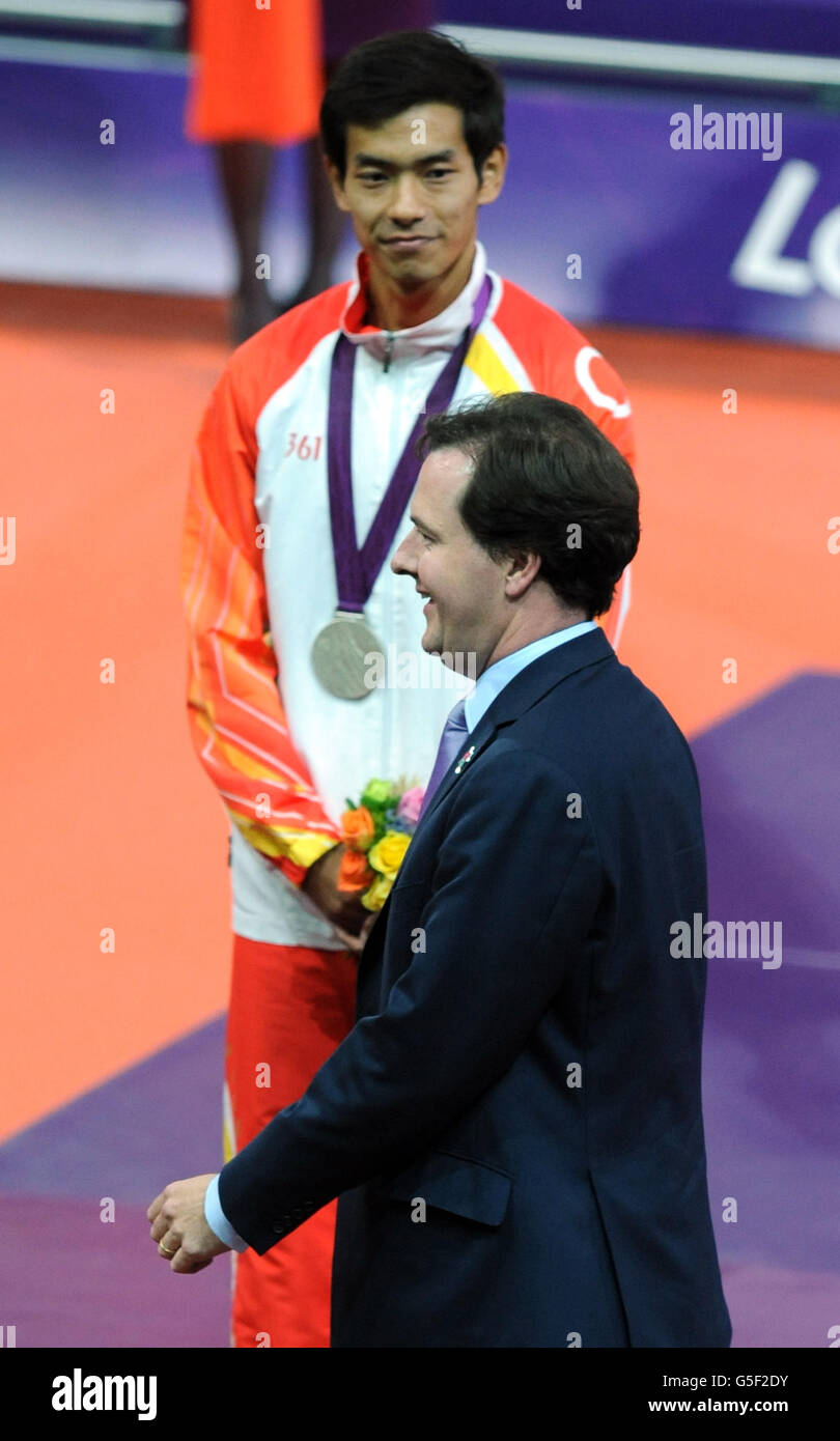 Chancellor George Osborne presents medals for the men's T38 400m race, during which he was loudly booed as his name was announced in the Olympic Stadium, at the Paralympic Games in Stratford, London. Stock Photo