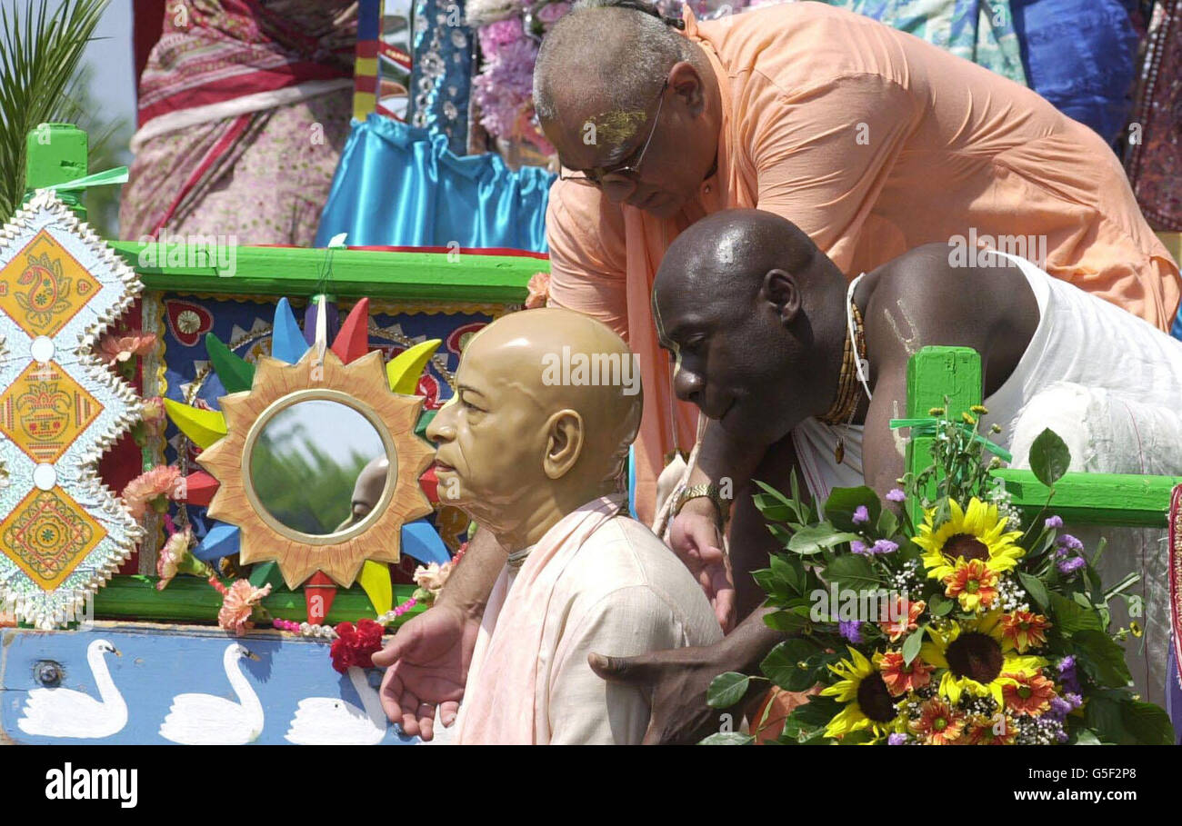 A wax work of the founder of the Hare Krishna movement in Britain is lifted onto a float in Hyde Park in central London as part of the celebration of the 33rd international Rath Yatra festival. The carnival marks a 5,000-year-old Indian tradition. * and Trafalgar Square will be transformed with colourful floats, musicians, dancers, costumed artists, bullock carts, stalls, music and plays. Organisers International Society for Krishna Consciousness are distributing free food to all the partygoers. Stock Photo