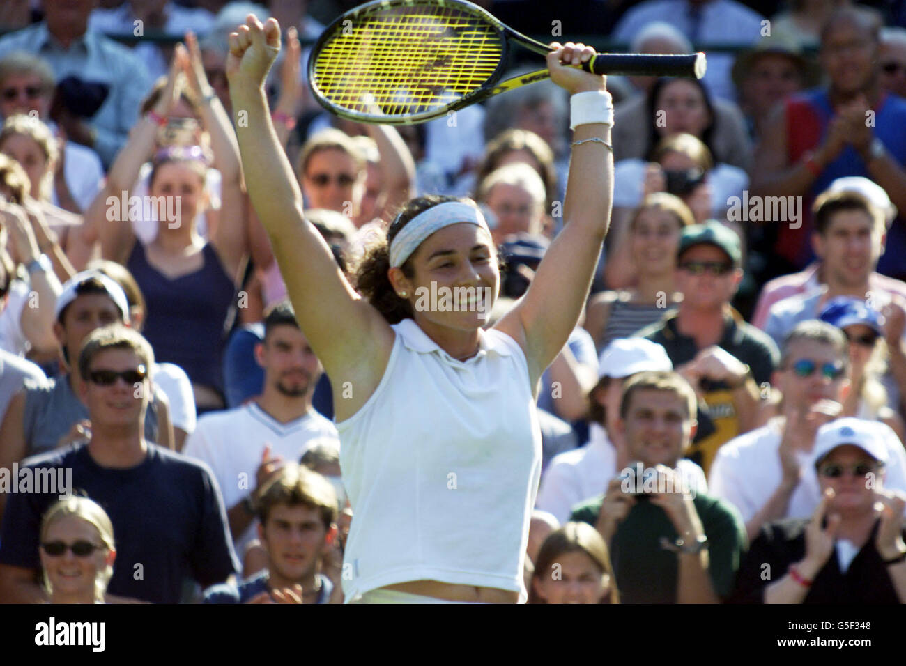 Spain's Virginia Ruano Pascual celebrates after beating Switzerland's Martina Hingis in the First Round match of the Lawn Tennis Championships at Wimbledon, London. Stock Photo