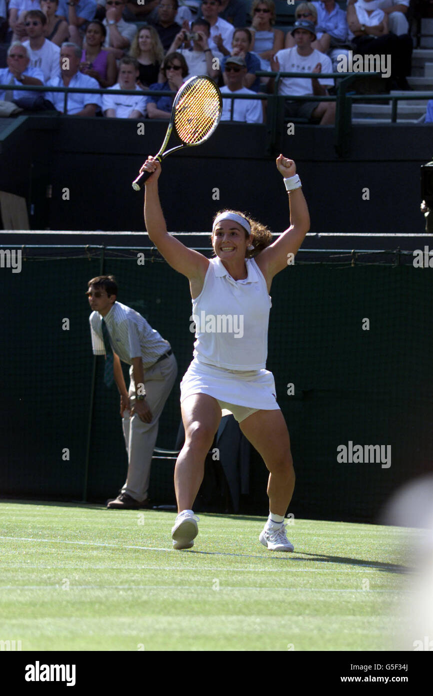 NO COMMERCIAL USE: Spain's Virginia Ruano Pascual celebrates after beating Switzerland's Martina Hingis in the First Round match of the Lawn Tennis Championships at Wimbledon, London Stock Photo