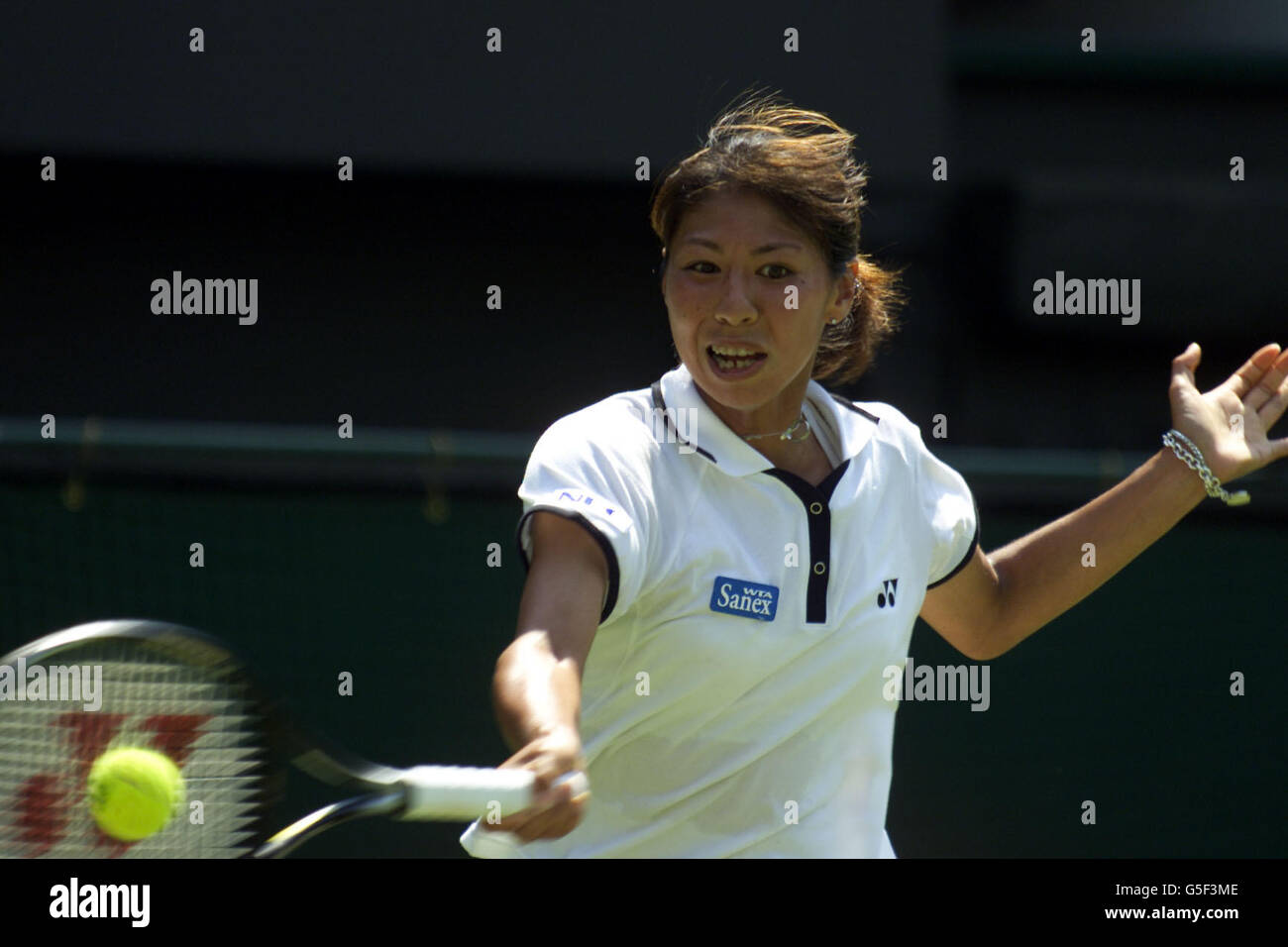 Japan's Shinobu Asagoe in action against USA's Venus Wiilliams during the First Round match of the 2001 Lawn Tennis Championships at Wimbledon, London. Stock Photo
