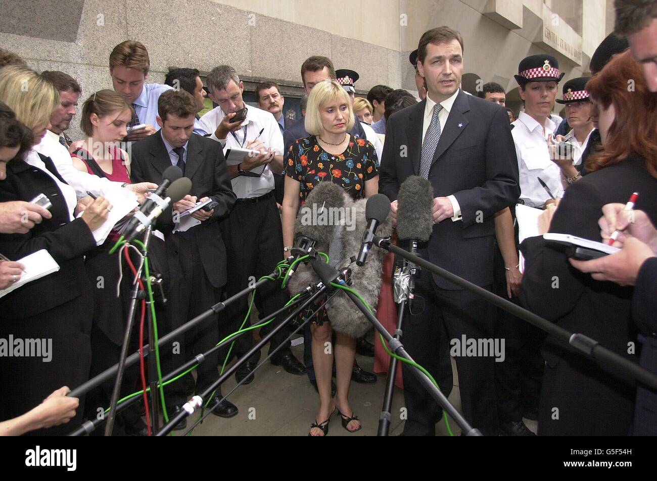 Alan Farthing, fiance of Jill Dando surrounded by the media outside the Old Bailey in London, with family friend Jenny Higham following the conviction of Barry George of the murder of the TV presenter in 1999. Stock Photo
