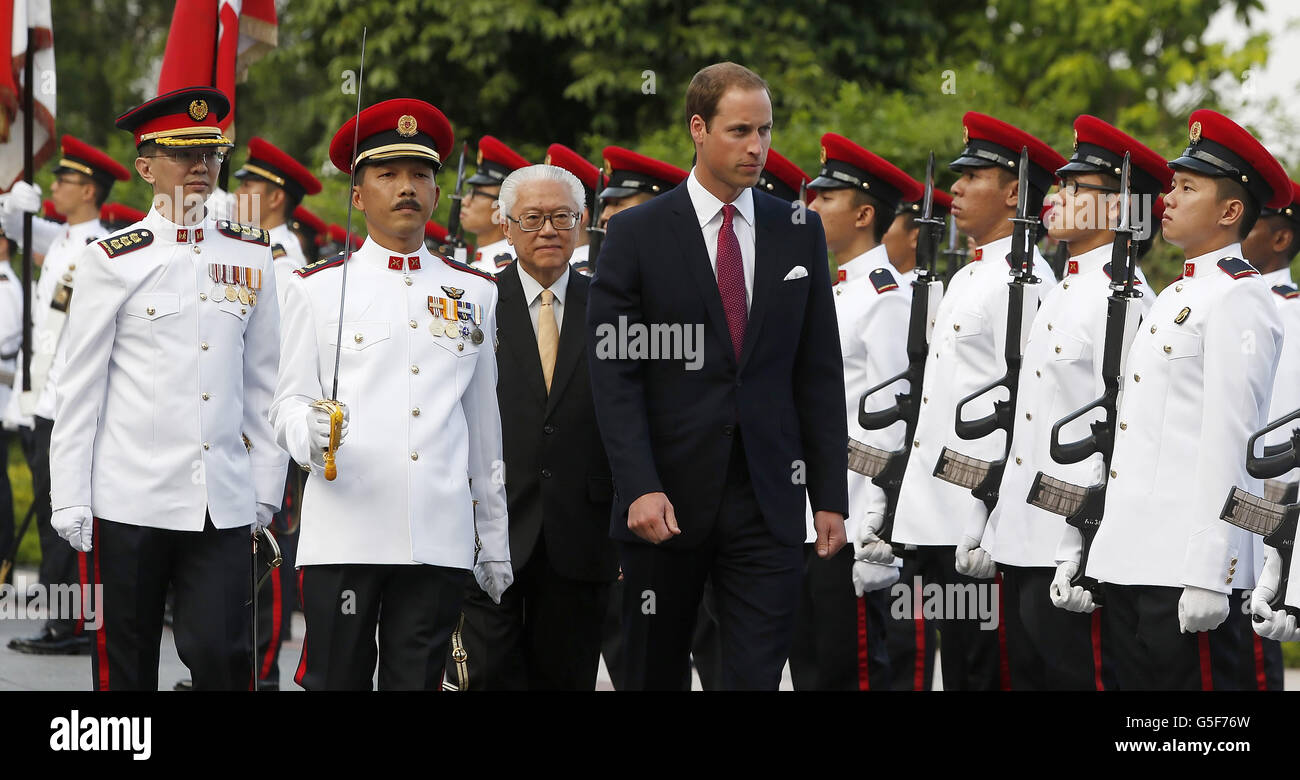 The Duke of Cambridge and the President of Singapore Tan Keng Yam Tony review a Guard of Honour during a visit to the Istana, Singapore, on day one of a nine-day tour of the Far East and South Pacific in honour of the Queen's Diamond Jubilee. Stock Photo