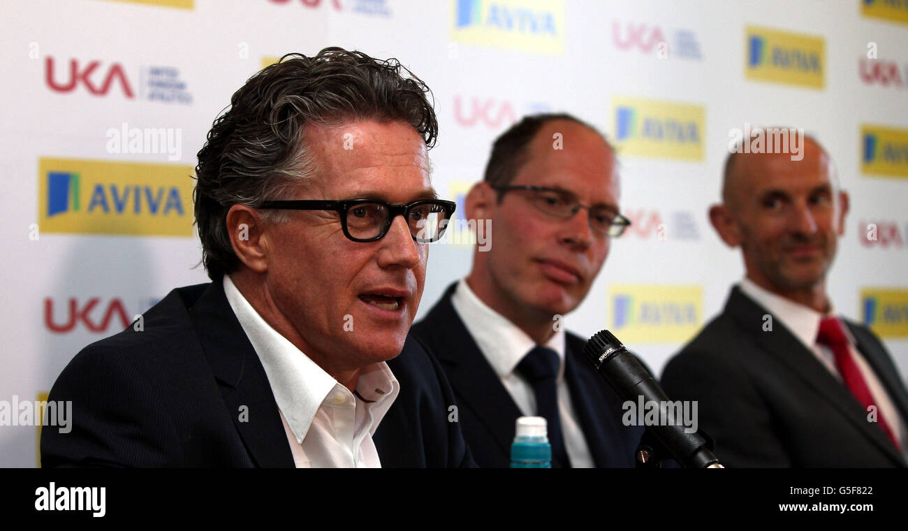 Charles van Commenee the departing Head coach of UK Athletics (left) speaks at the announcement of Neil Black (right) as Performance Director as Chief Executive Niels de Vos looks on during the Press Conference at the Alexander Stadium, Birmingham. Stock Photo