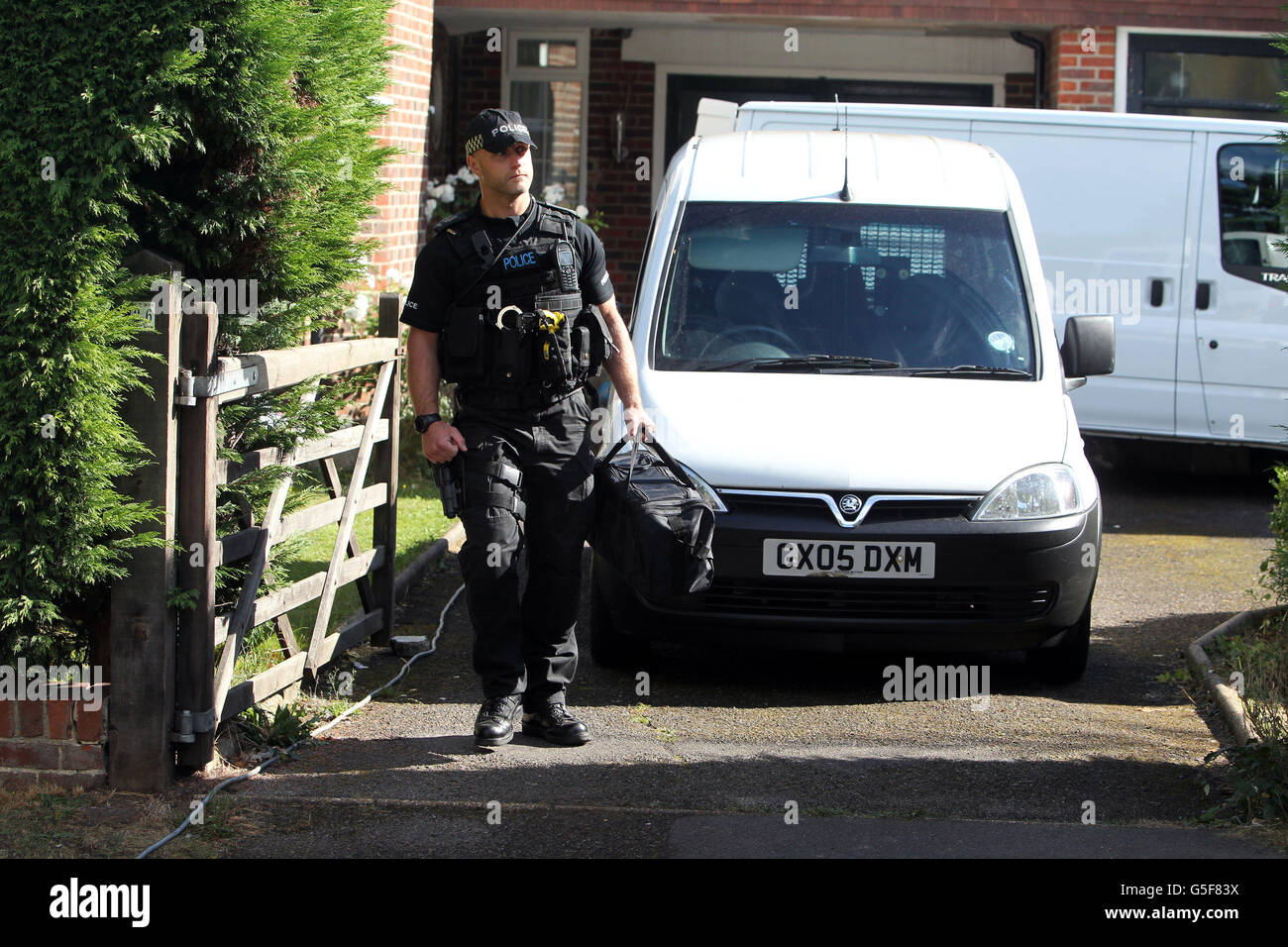 Alps shooting. A firearms officer at the home of Saad al-Hilli in Claygate, Surrey. Stock Photo