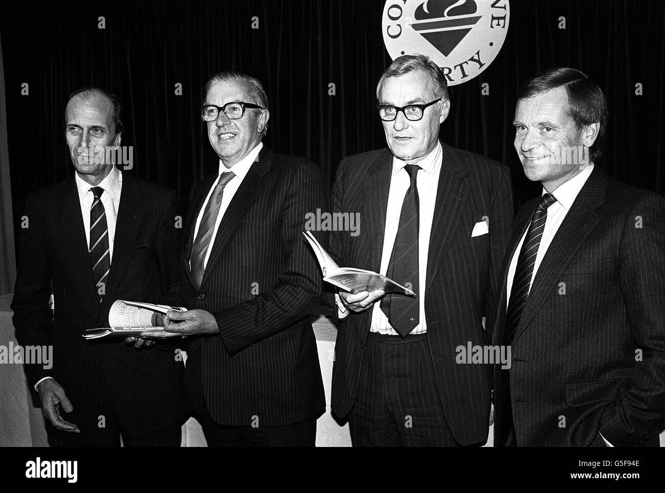 A Conservative Party press conference on their annual conference agenda was held at their Central Office in London. (l-r) Norman Tebbit, Party Chairman; Sir Peter Lane, chairman, executive Committee; Patrick Lawrence; Conference chairman and Jeffrey Archer, Party deputy chairman, Stock Photo