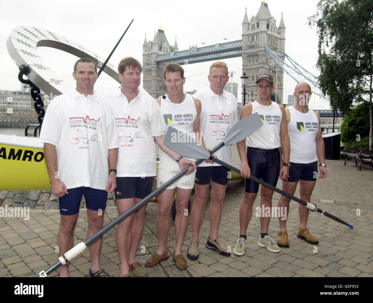 Left-right: Mark Stubbs (Poole), Phil Scantlebury ( Poole) and four from Jersey, John Searson, Carl Clinton, Paul Le Gros and Ian Anderson at St Katharine's Dock, central London. Their attempted world record row from London to Amsterdam was delayed by poor weather. * The six-man boat was due to leave from the capital this morning but will now leave just before midnight tonight. The crew, who are attempting the journey for the first time in history, are hoping to reach Amsterdam in under 50 hours. Stock Photo