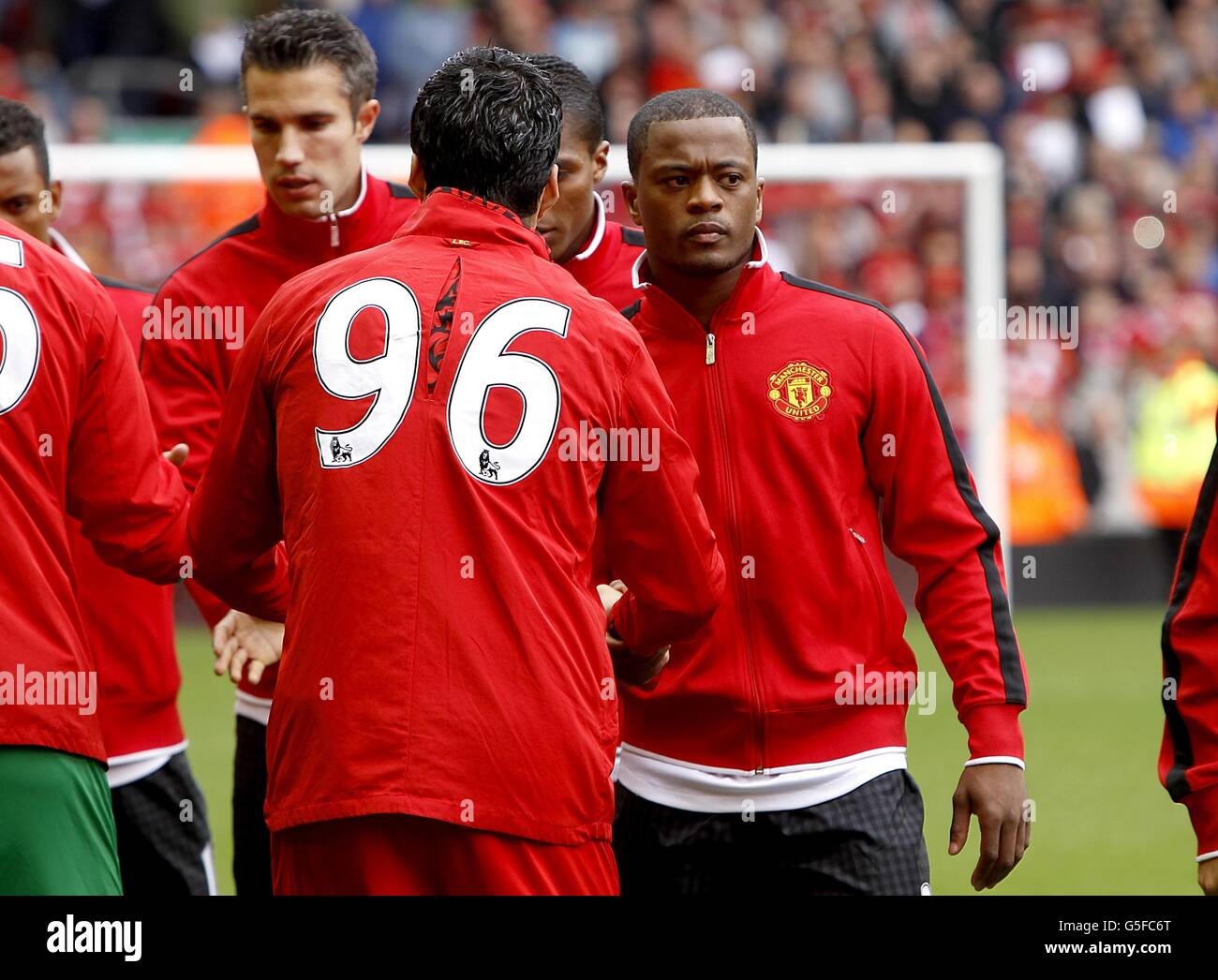 Liverpool's Luis Suarez (left) and Manchester United'S Patrice Evra shake  hands prior to kick-off of the Barclays Premier League match at Anfield,  Liverpool Stock Photo - Alamy, image size:1300x1046