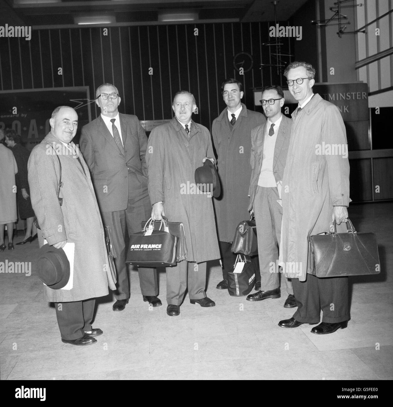 Members of the British Economic Survey Mission are pictured at Heathrow Airport as they head for Mauritius, where they will spend five weeks investigating the future prosperity of the island's inhabitants. Professor James Meade (far right) is chairman of the mission. Others in the group are Mr H Houghton, Mr RS Marshall, Mr GM Roddan, Mr P Selwyn and Mr AK Russell. Stock Photo