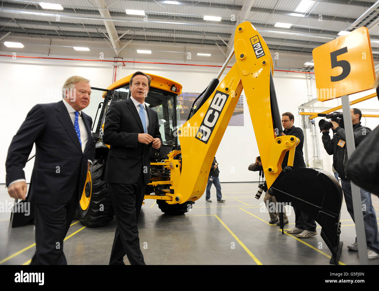 Prime Minister David Cameron tours a new JCB factory in Sao Paulo with company chairman Sir Anthony Bamford during the first of a two day visit to Brazil. Stock Photo