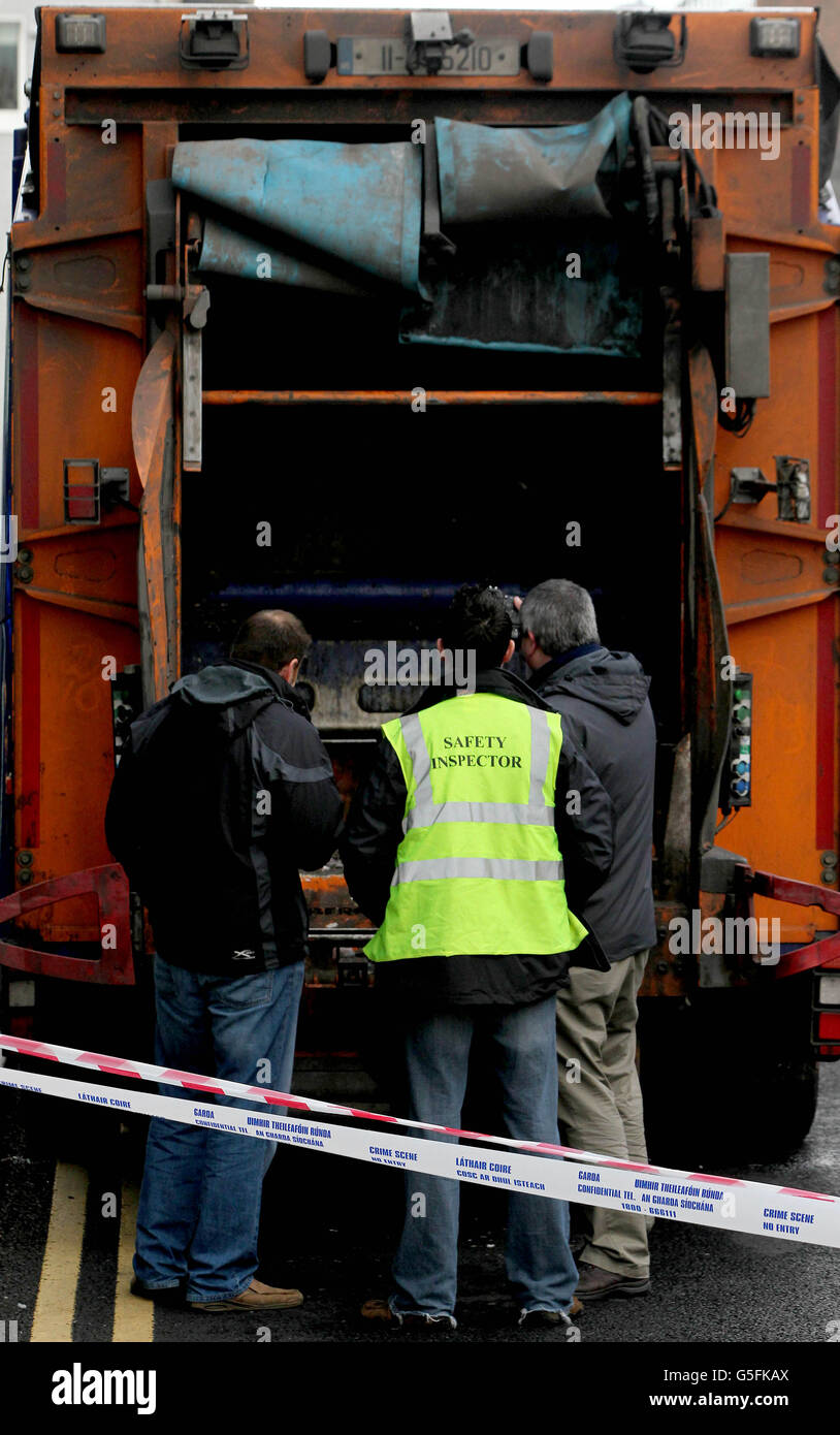 Health and Safety inspectors at the scene where a refuse collector was