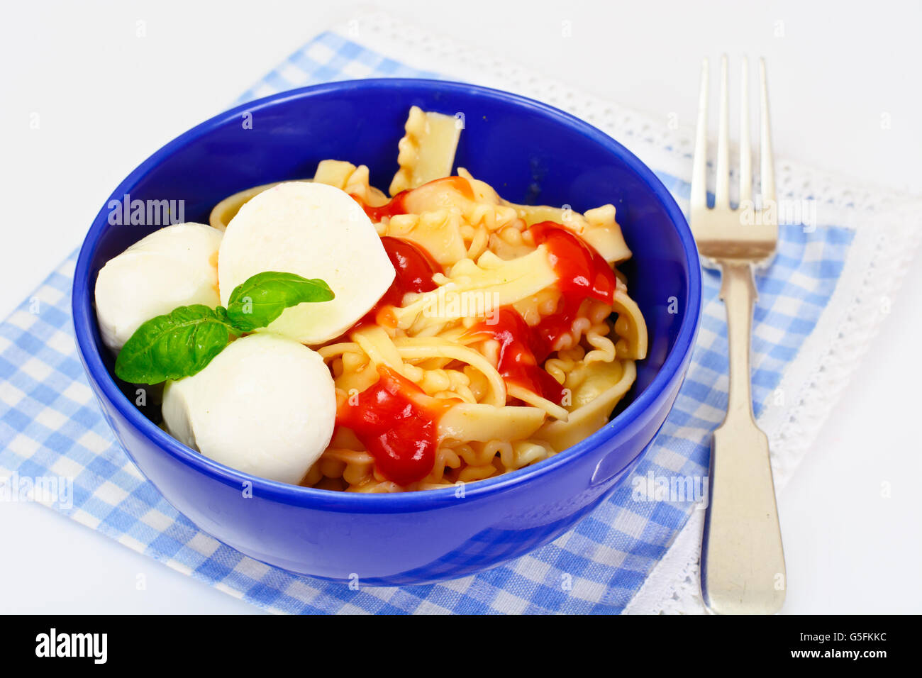 Pasta with Tomato Sauce Ketchup, Mozzarella and Basil Stock Photo