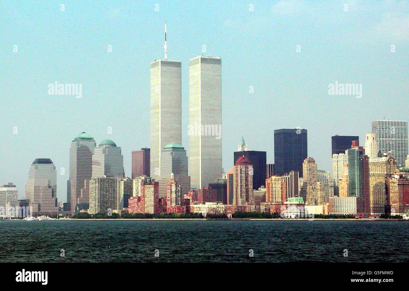 Taken from Ellis Island of Manhattan's skyline showing the twin towers of the World Trade Center (C) which have both collapsed following a terrorist attack, each being hit by a passenger jet. The Pentagon in Washington was hit by a third plane. * and a fouth plane crashed outside Pittsburgh. Stock Photo