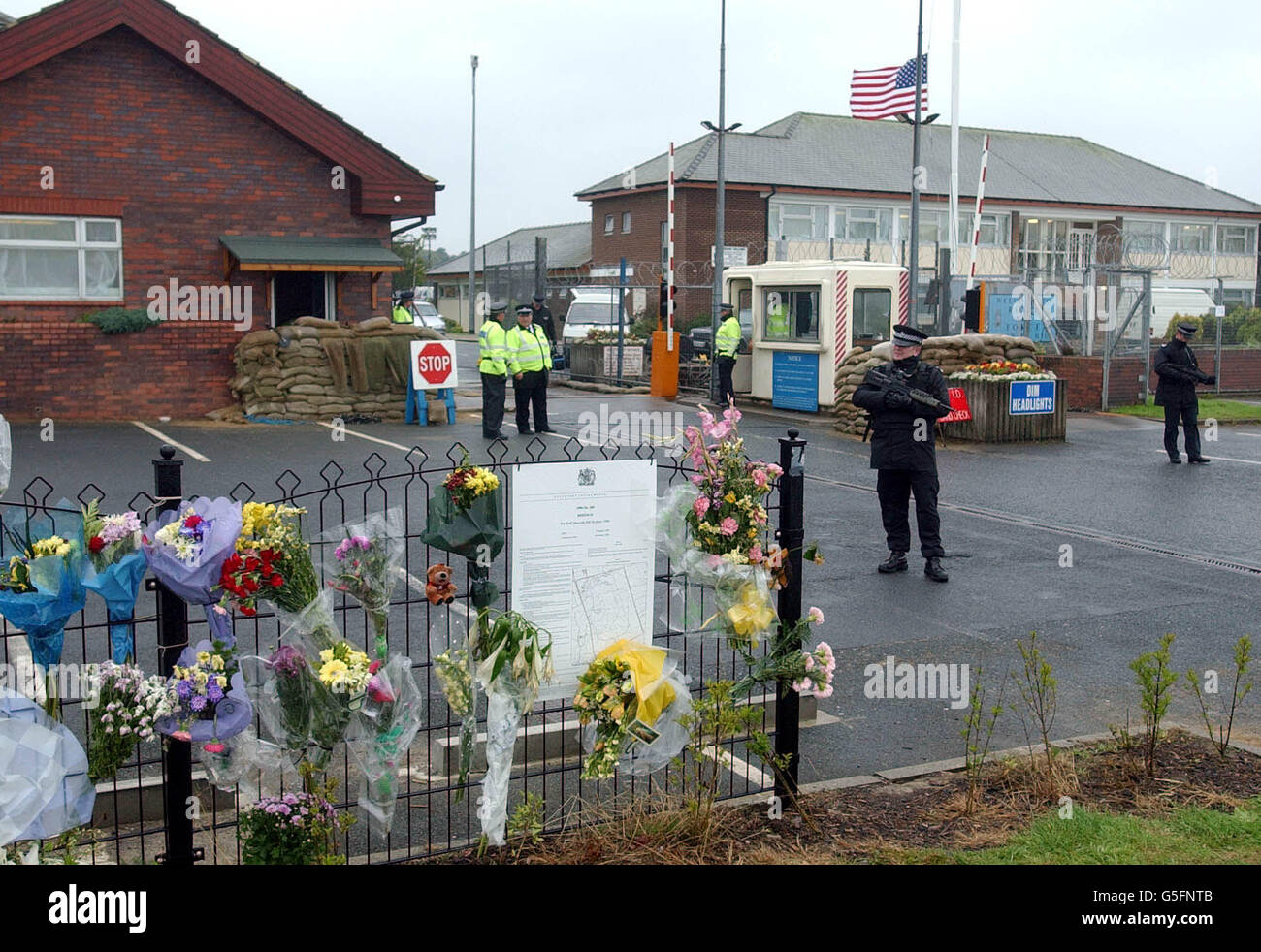 The USAF Listening base at RAF Menwith Hill near Harrogate, where increased levels of visible security mingle with floral tributes left on a perimeter fence at the base in memory of those who were killed in the terrorist attacks in the USA. Stock Photo