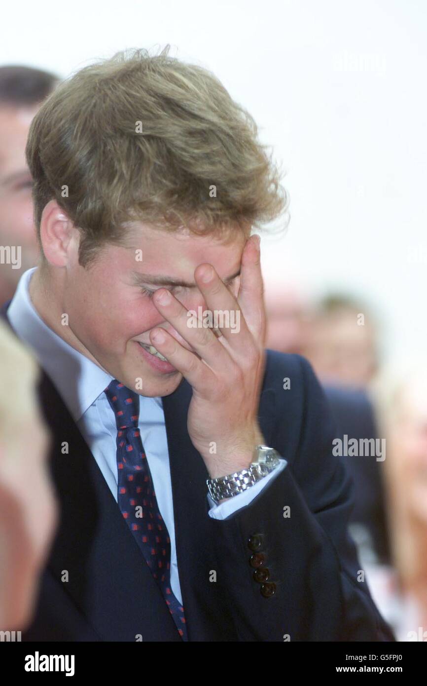 Prince William covers his face as he listens to his father, Prince Charles, making a joke about his son sleeping late during a speech at the Lighthouse building in Glasgo. The two were visiting various parts of Scotland on a one day tour. *Prince William is to start at St Andrews University on a four year History of Art degree. See PA story ROYAL William. PA photo: Les Gallagher/ The Sun/ROTA Stock Photo