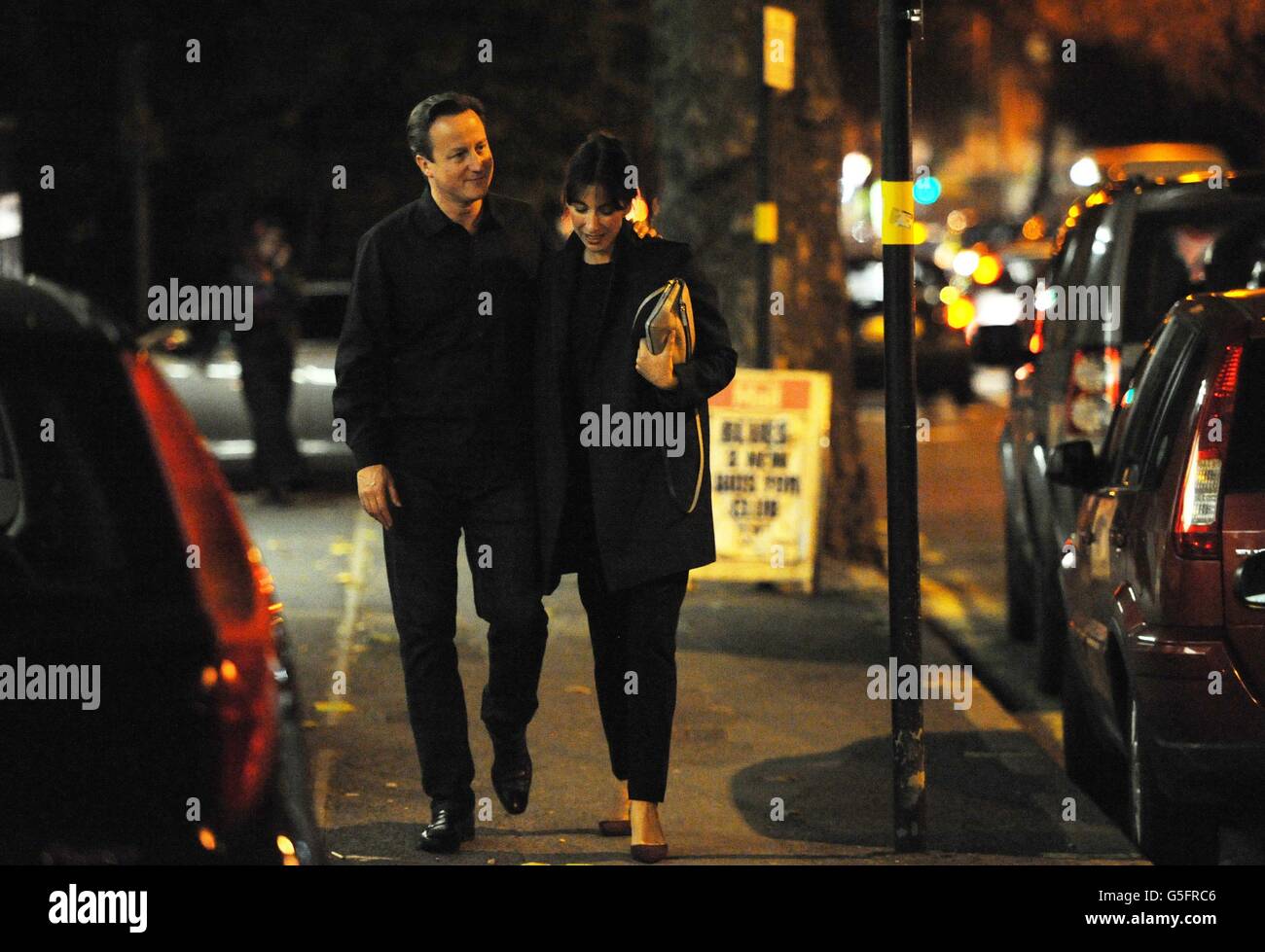 Prime Minister David Cameron and his wife Samantha arrive at the Diwan Balti restaurant in Birmingham to celebrate his 46th birthday, whilst in the city for the Conservative Party conference. Stock Photo