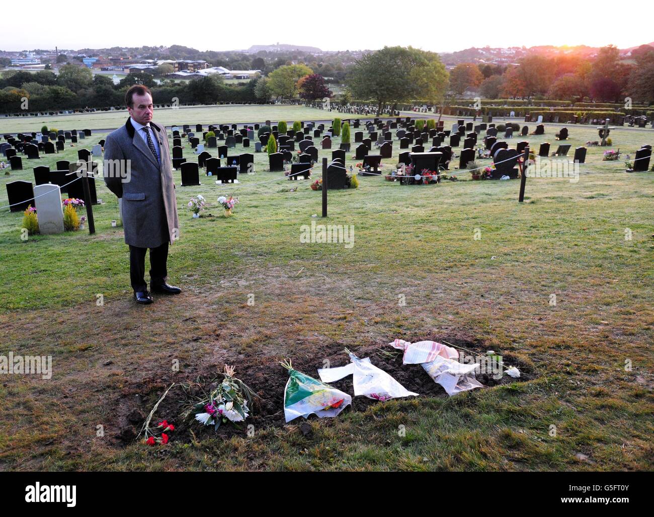 Funeral director Robert Morphet stands next to the grave of Sir Jimmy Savile in Woodlands Cemetery, Scarborough, where he assisted the local council in removing the headstone at the request of Savile's family. Stock Photo