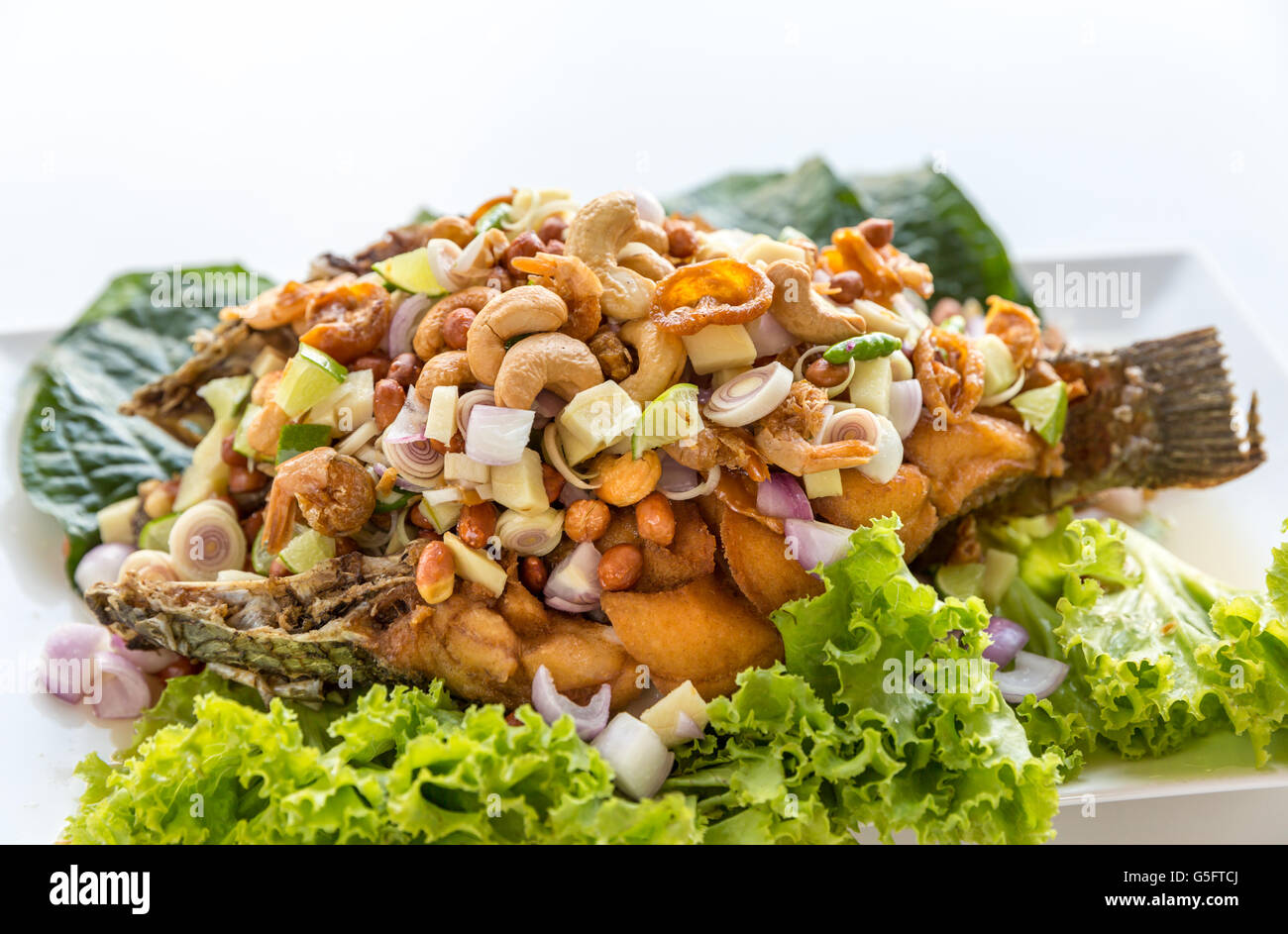 deep fried fish with salad Thai style Stock Photo - Alamy
